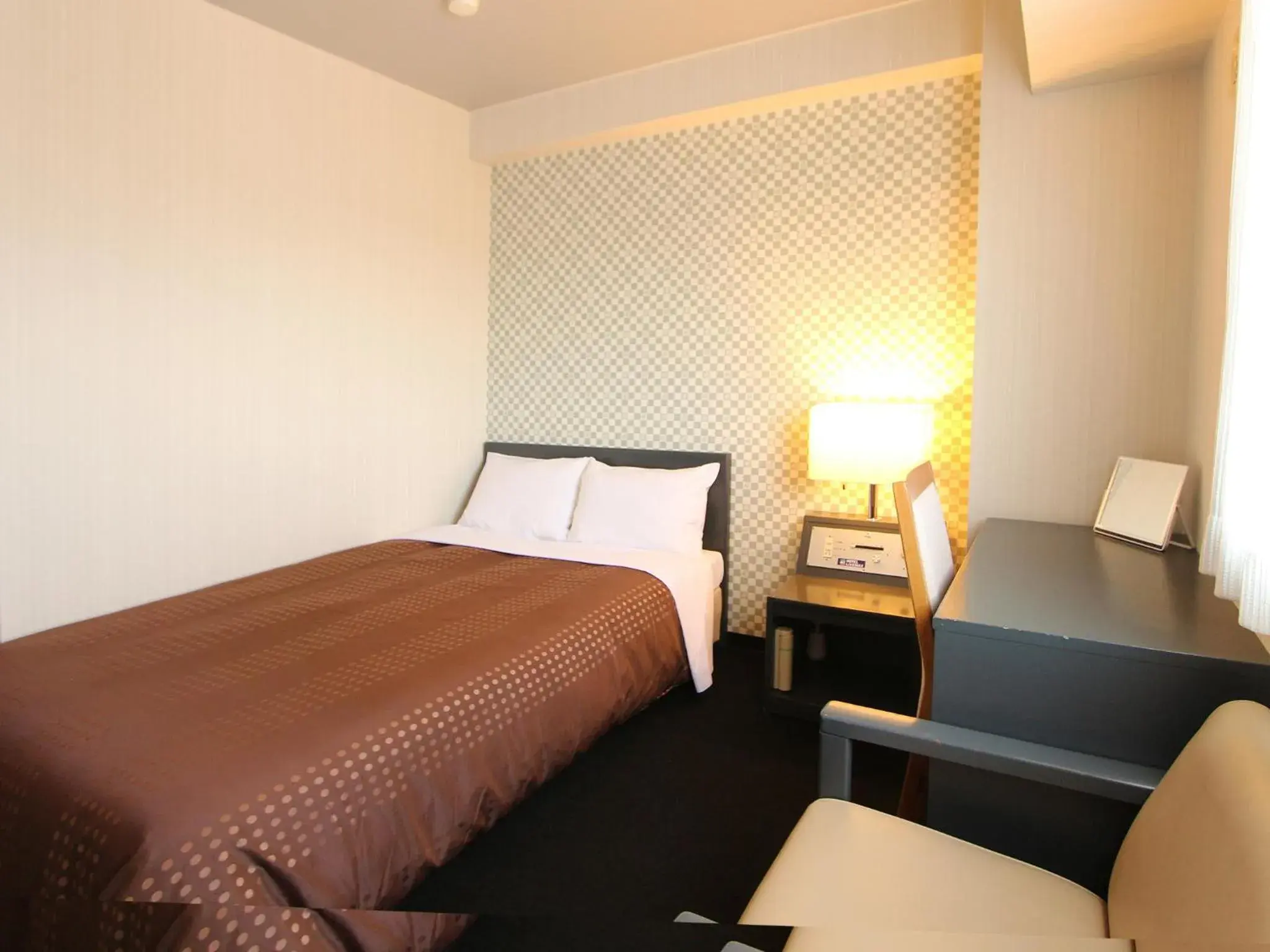 Bed in HOTEL LiVEMAX BUDGET Chitose