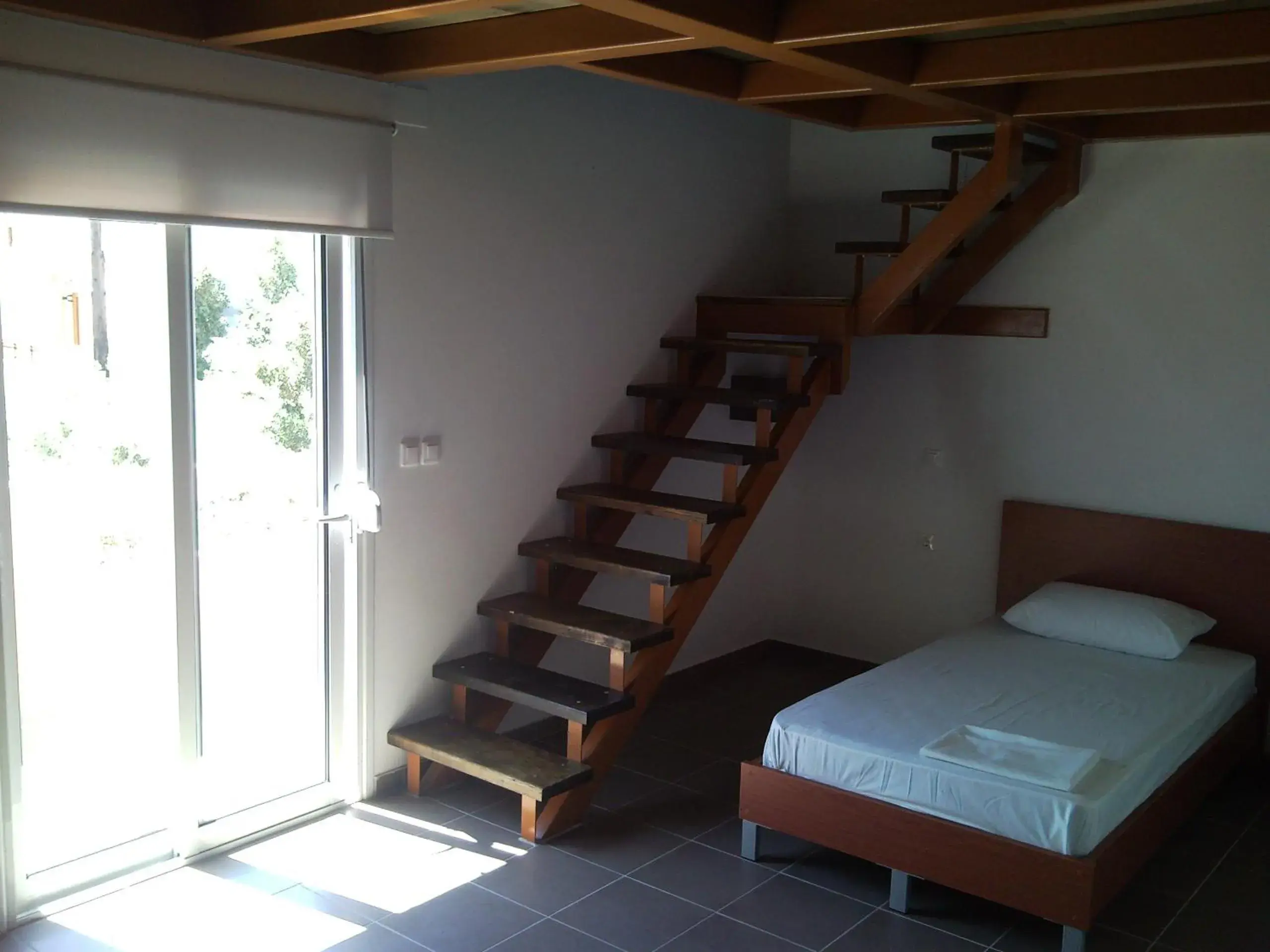 Living room, Bed in Elounda Sunrise Apartments