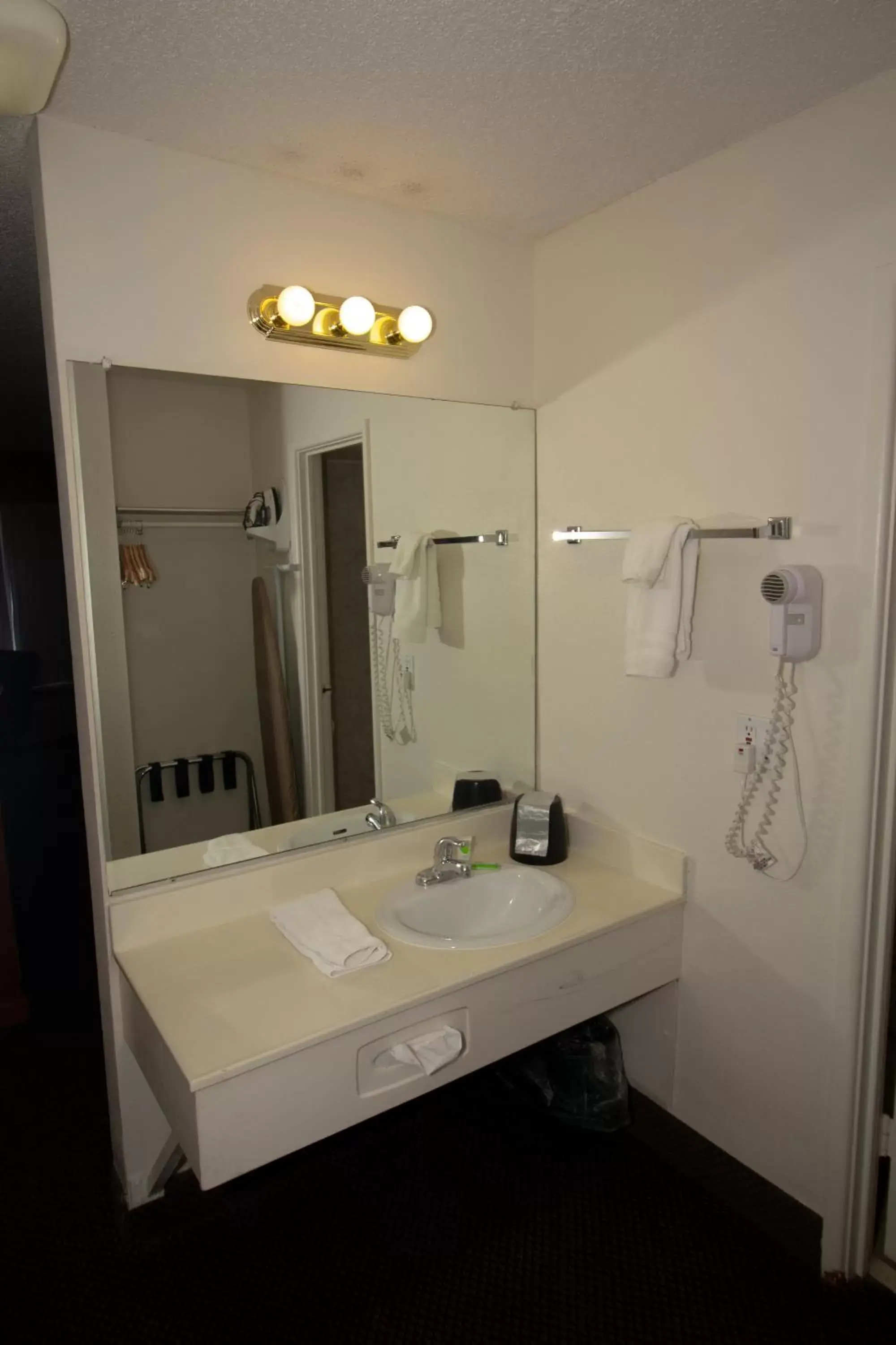 Bathroom in FairBridge Extended Stay, a Kitchenette Hotel