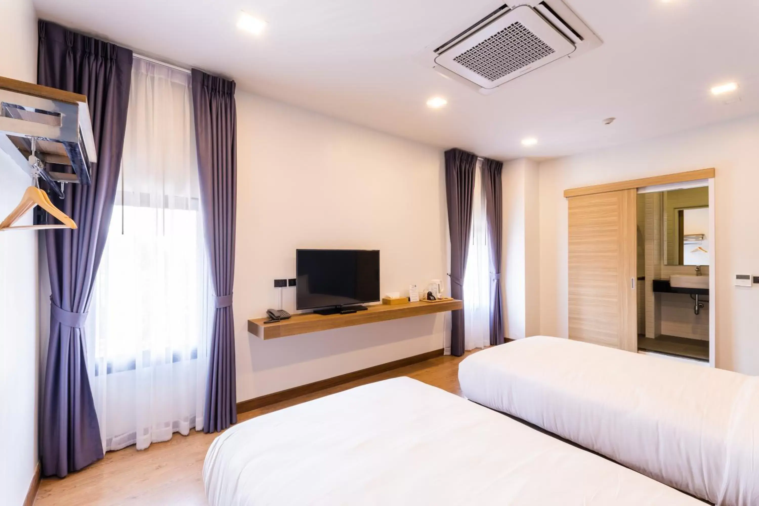 Bed, TV/Entertainment Center in Icon Park Hotel, Chiang Mai- SHA Extra Plus