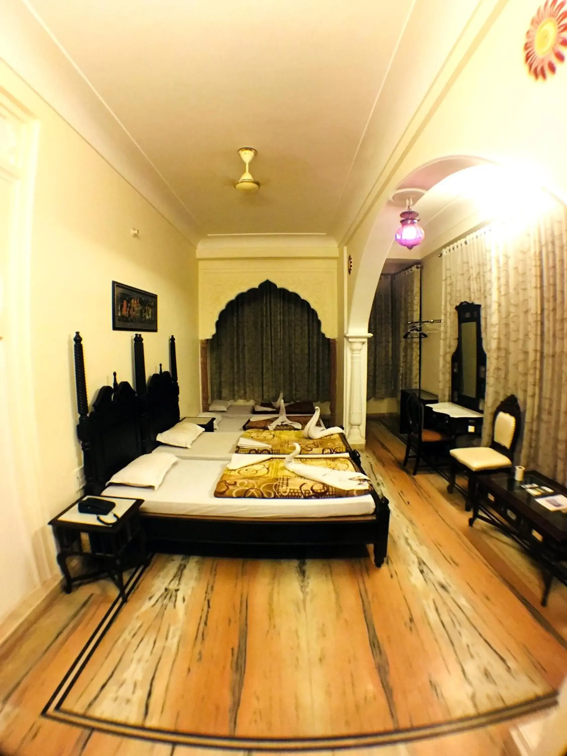Bed in Krishna Palace - A Heritage Hotel