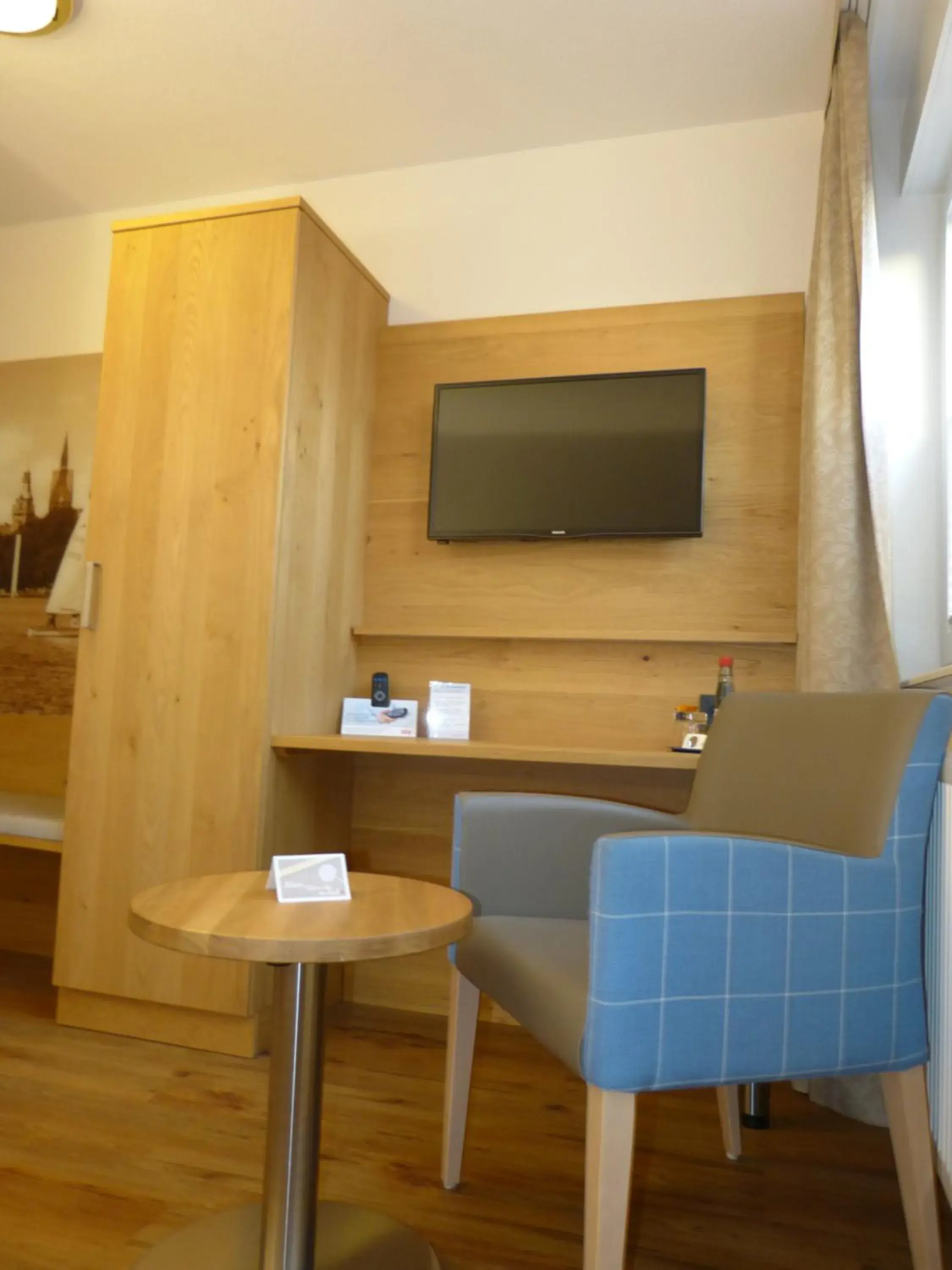 Seating area, TV/Entertainment Center in Landhaus Bolzum