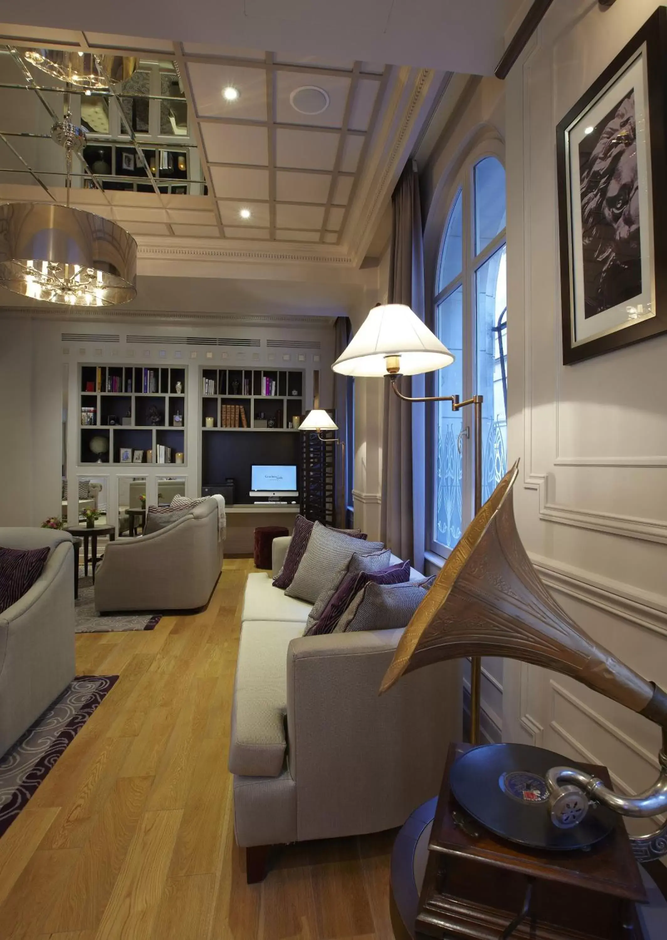 Communal lounge/ TV room, Seating Area in La Clef Louvre Paris by The Crest Collection