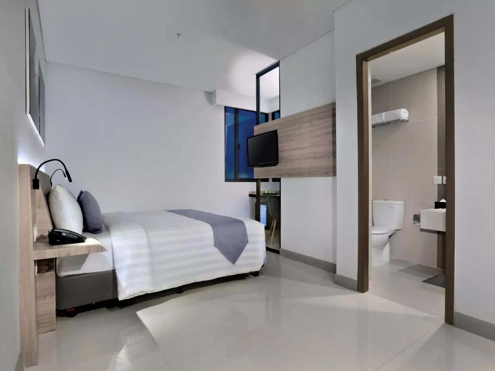Bed in Hotel Neo Gajah Mada Pontianak by ASTON Bed in Hotel Neo Gajah Mada Pontianak by ASTON