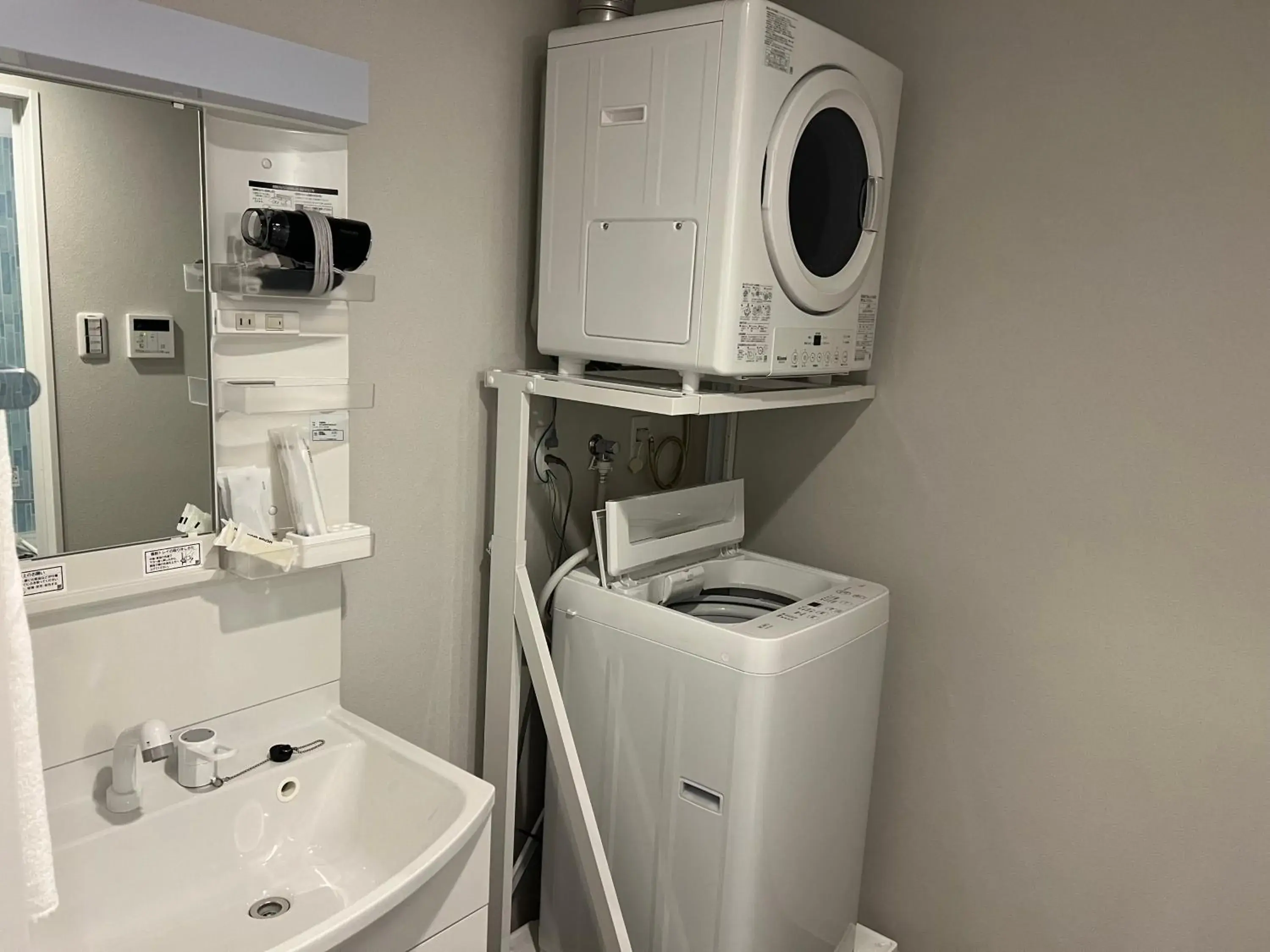 Bathroom in Kariyushi COndominium Resort Naha Living Inn Asahibashiekimae Annex and Premier