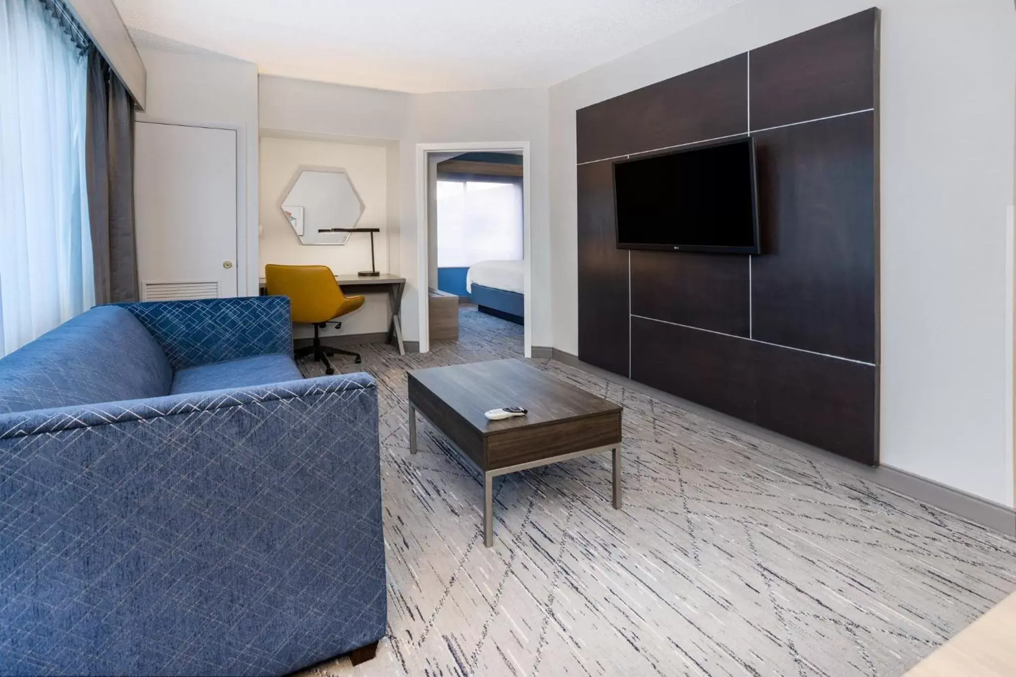 Bedroom, Seating Area in Holiday Inn Express and Suites Tampa I-75 at Bruce B. Downs, an IHG Hotel
