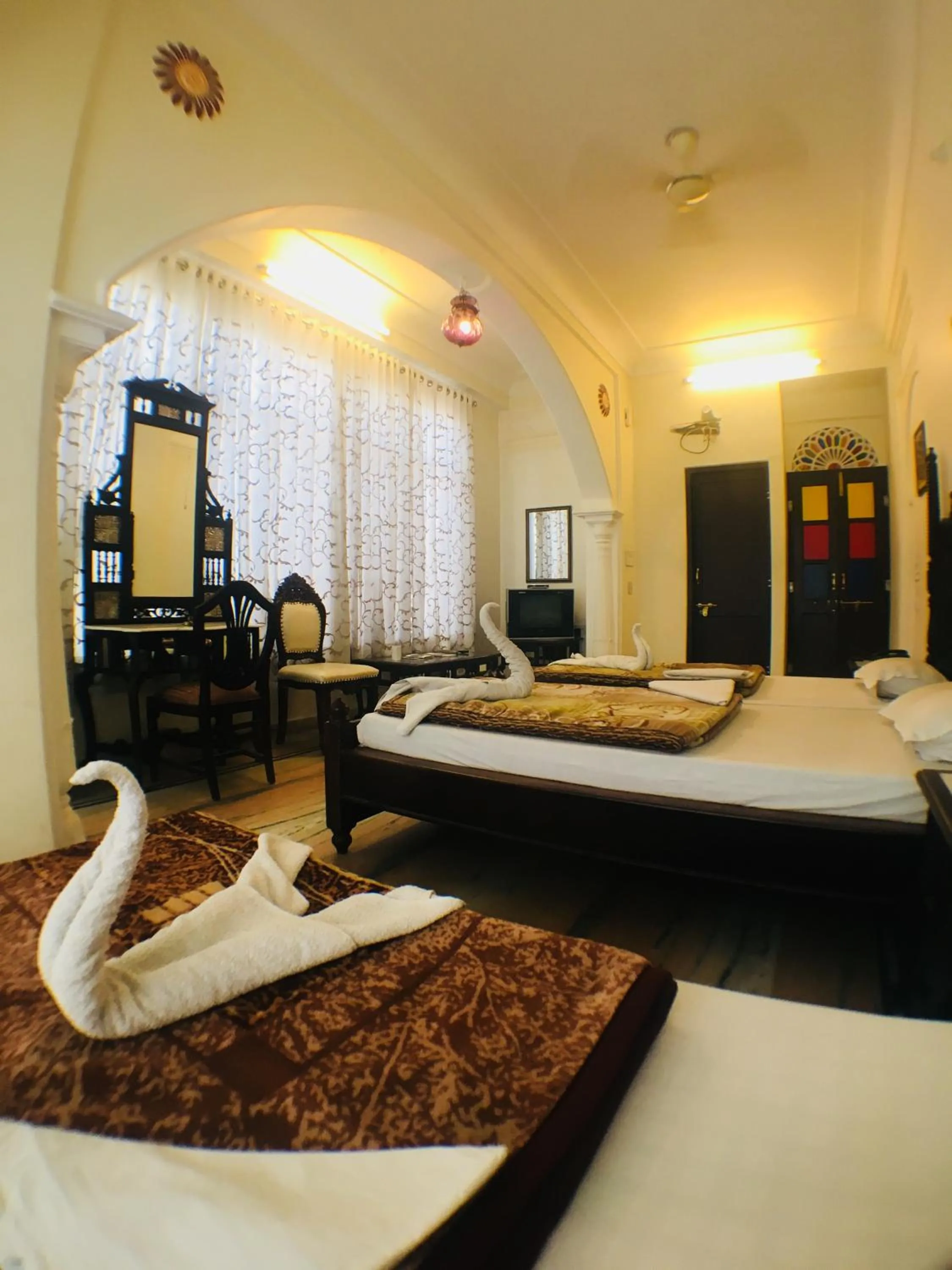 Bed in Krishna Palace - A Heritage Boutique Hotel