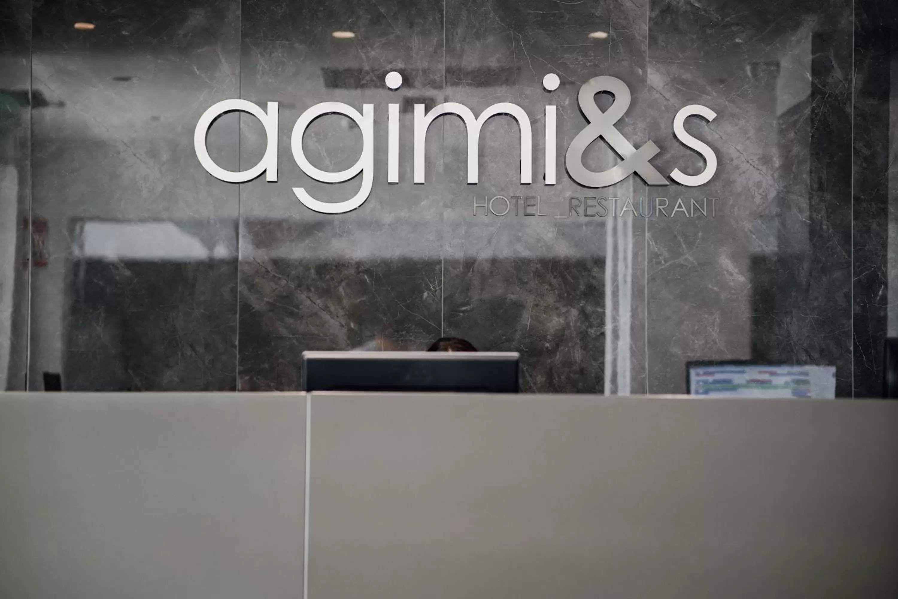 Property logo or sign in Hotel Agimi