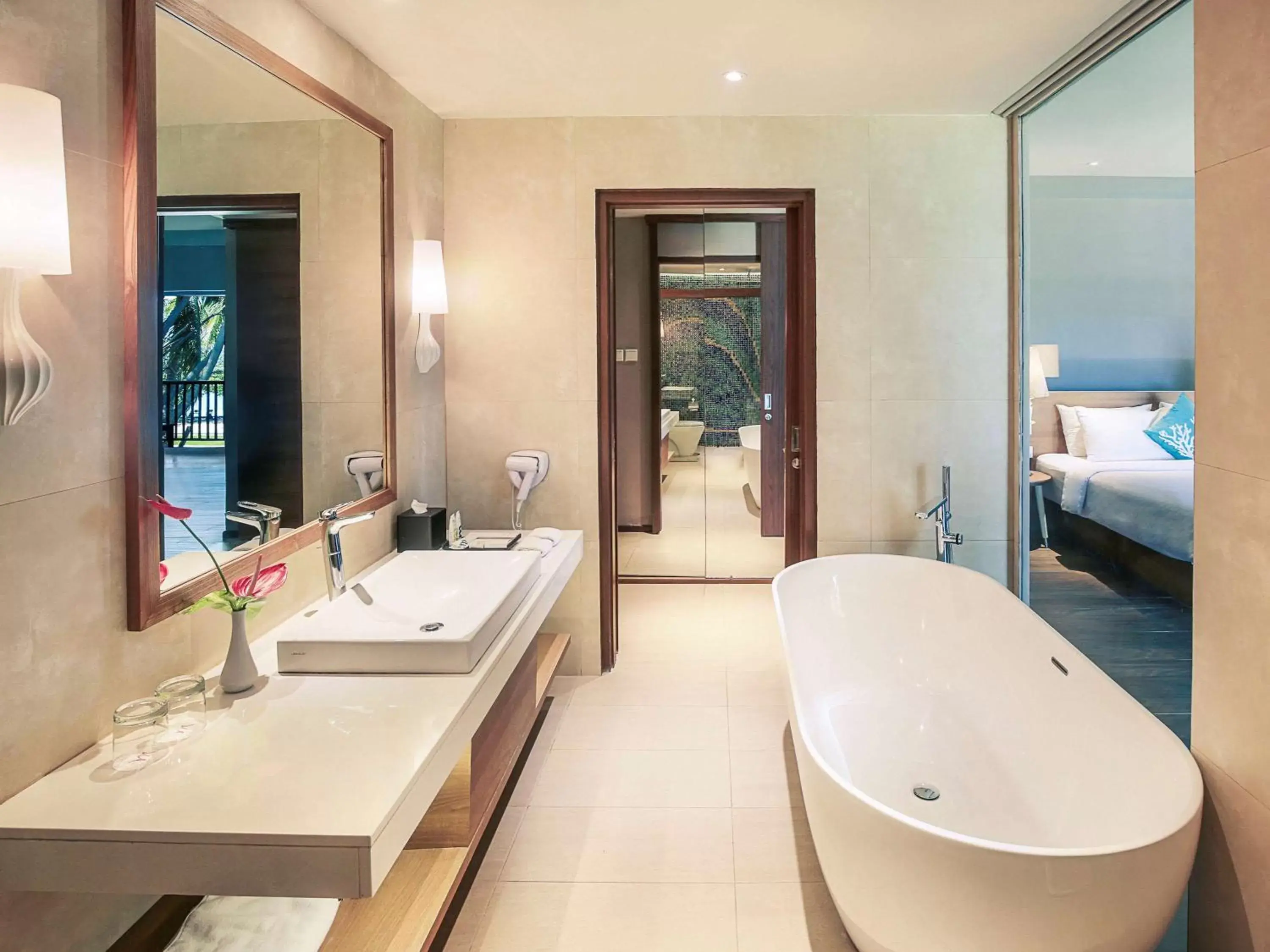 Photo of the whole room, Bathroom in Mercure Manado Tateli Resort and Convention