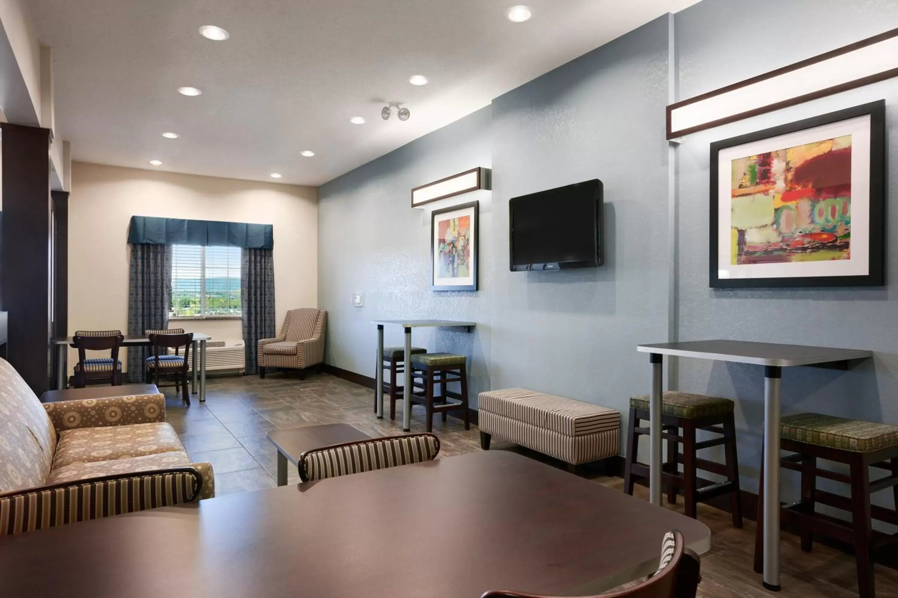 Communal lounge/ TV room, Seating Area in Microtel Inn & Suites by Wyndham Wilkes Barre