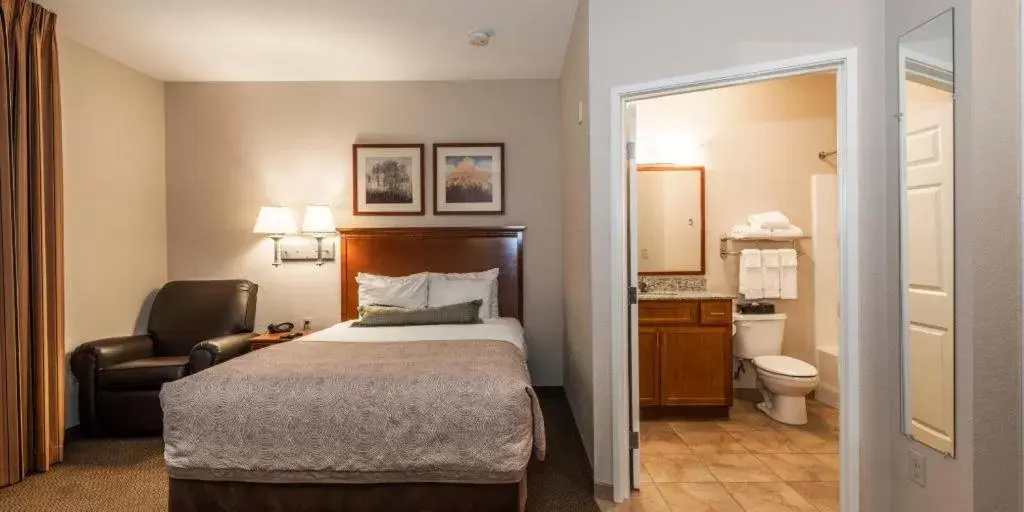 Bed in Candlewood Suites Burlington, an IHG Hotel
