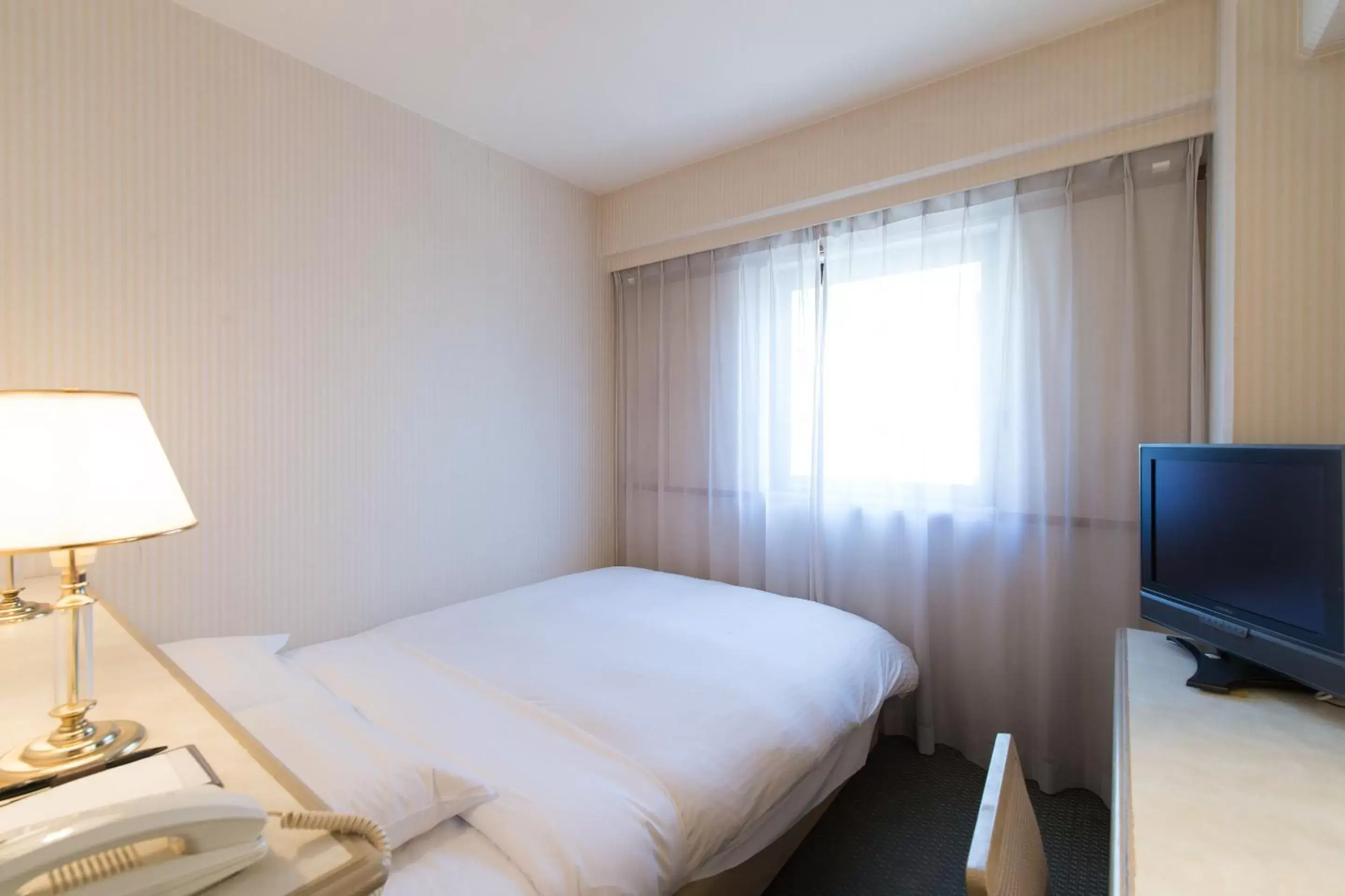 Photo of the whole room, Bed in Tabist Hotel Tetora Kitakyushu