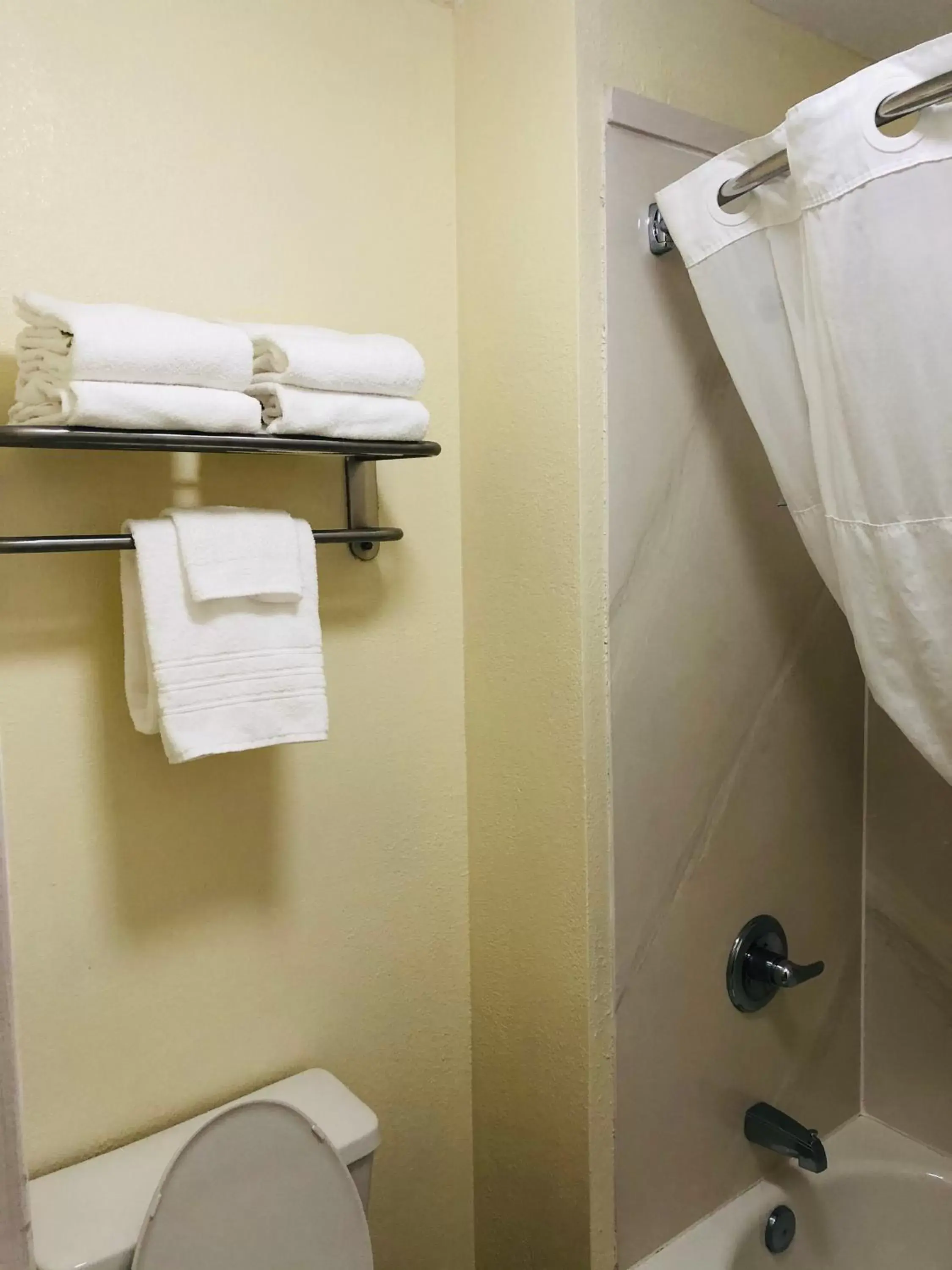 Bathroom in Days Inn & Suites by Wyndham Navarre Conference Center