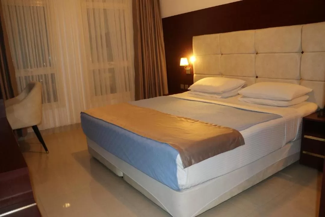 Bed in Golden Airport Hotel