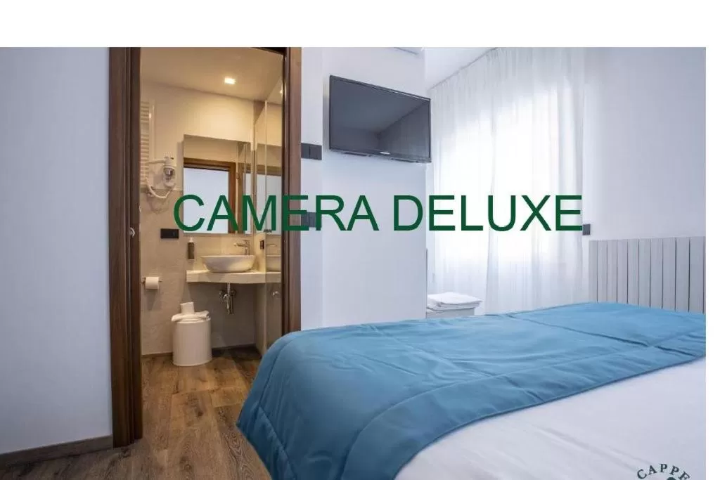 Bed in Albergo Cappello e Cadore