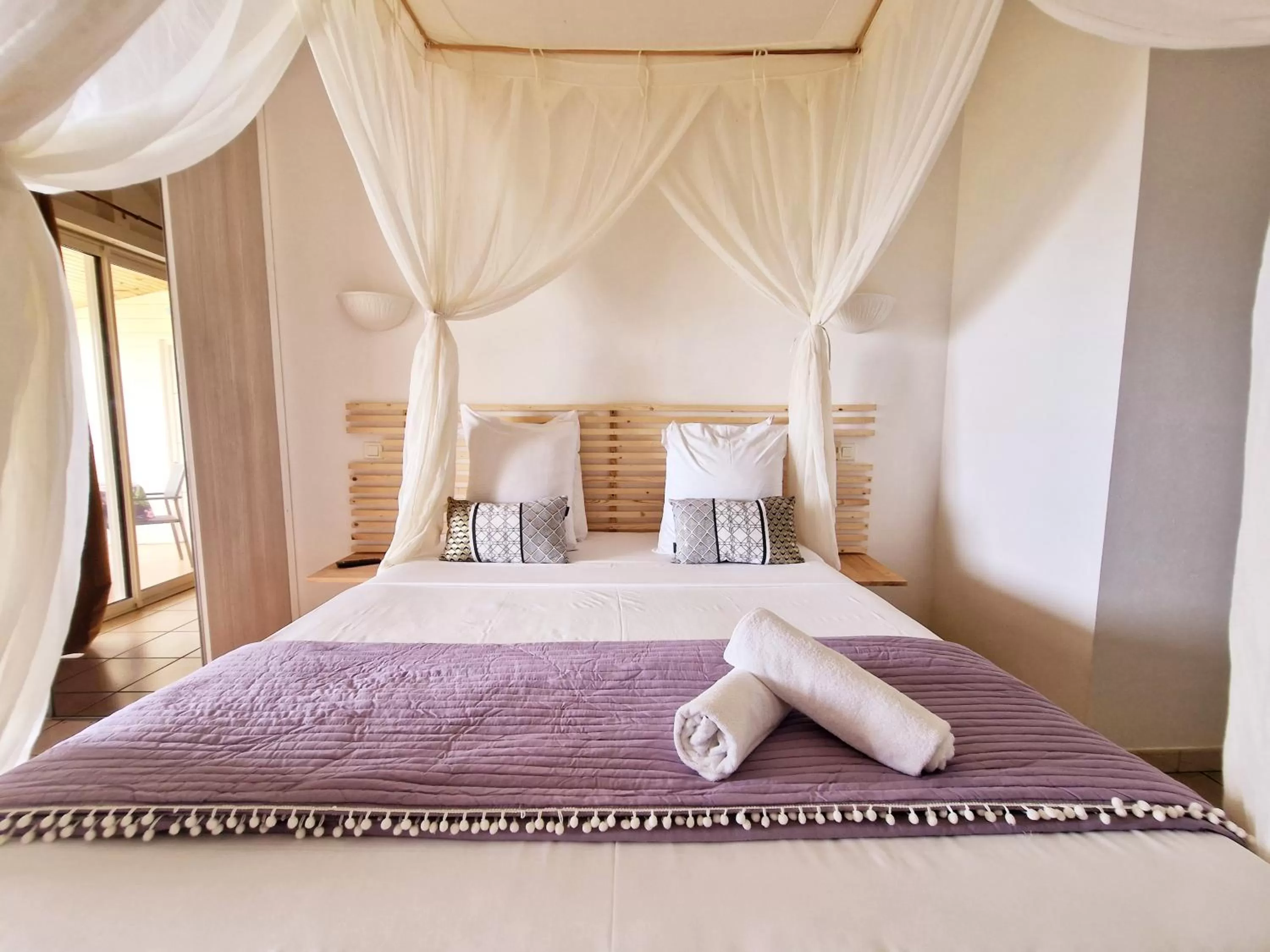 Bed in Hotel Le Manguier