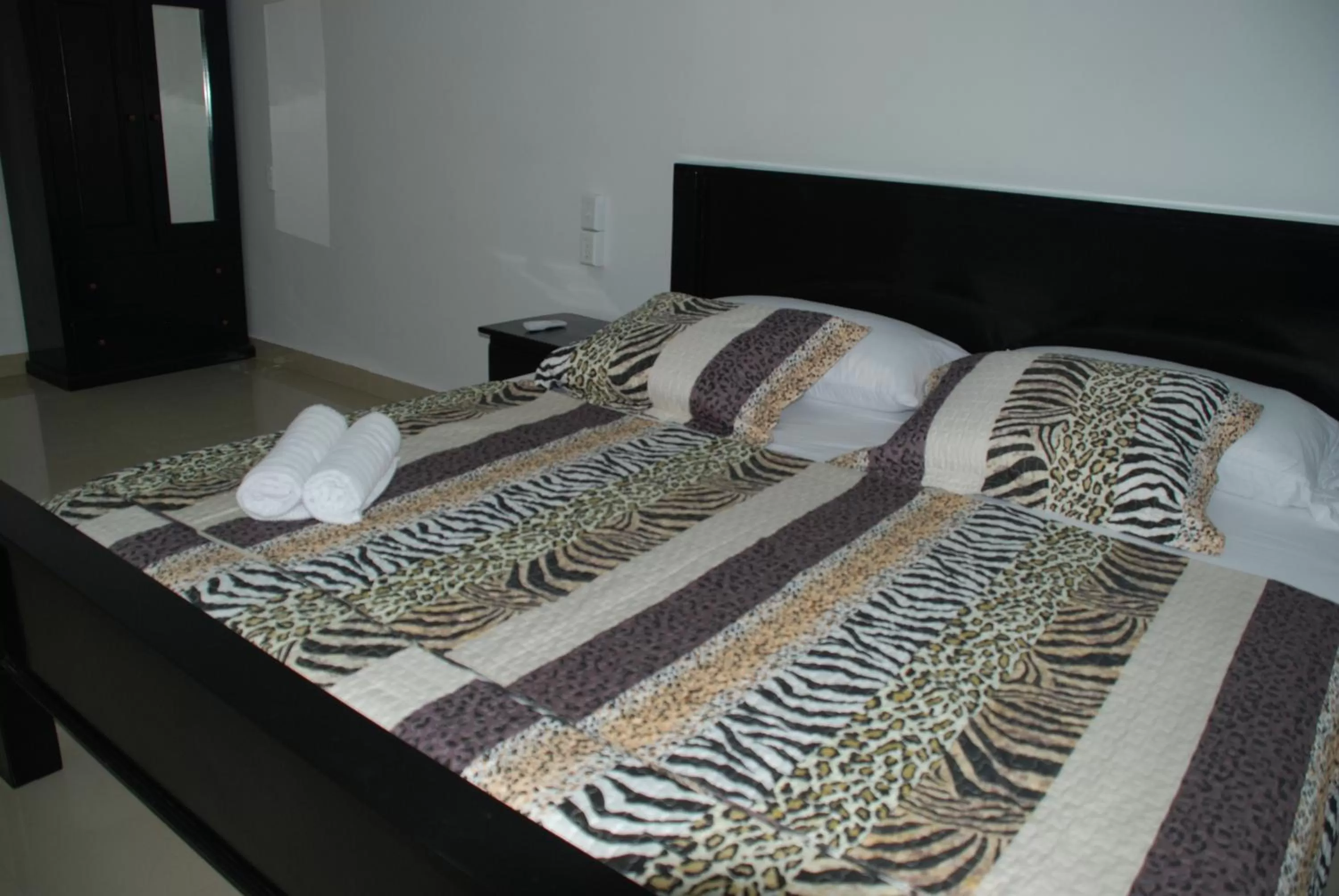 Bed in Hotel Coastalbay 2 & Golf Cart Rental