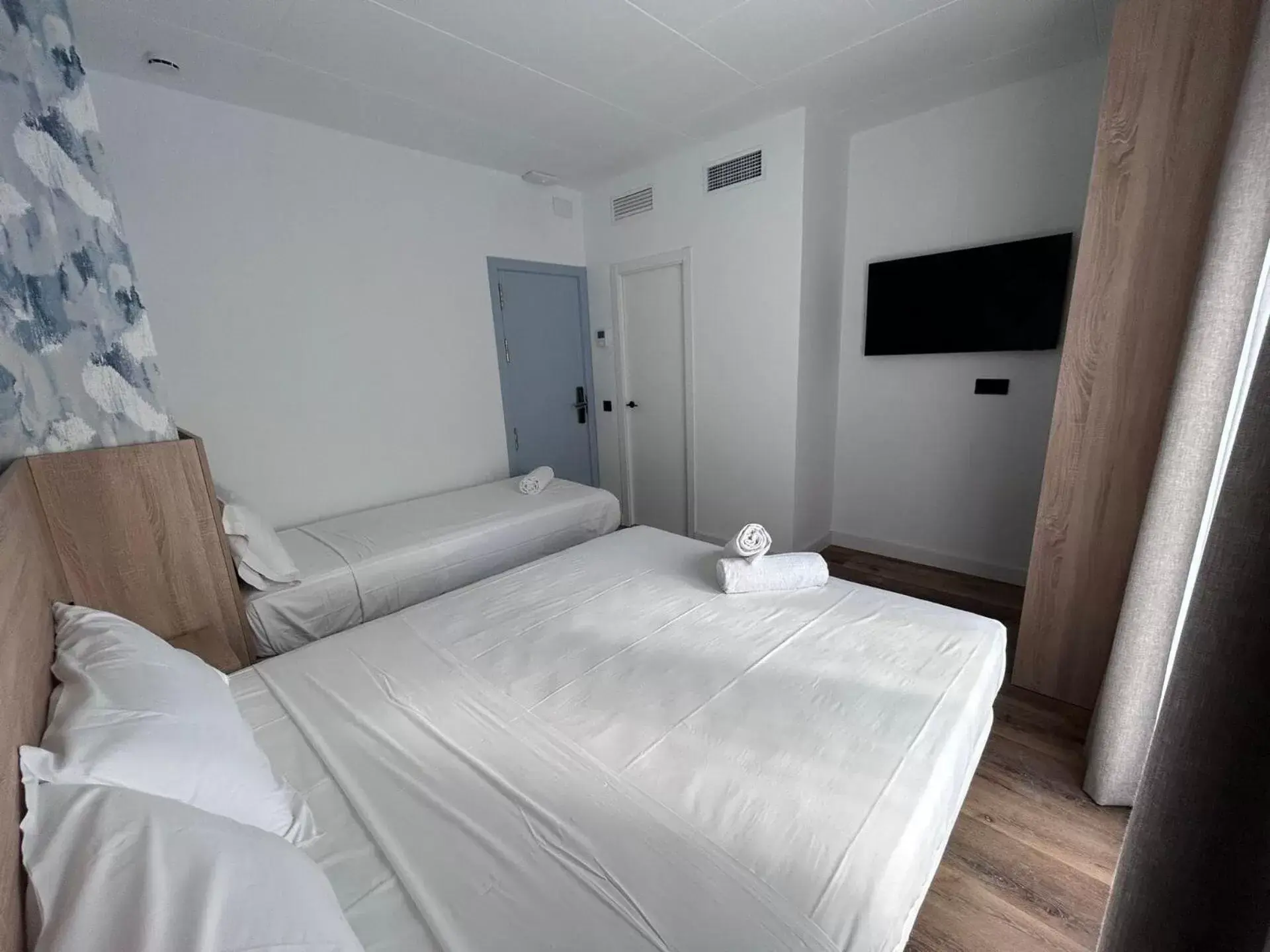 Bed in Sweet Lloret Suites