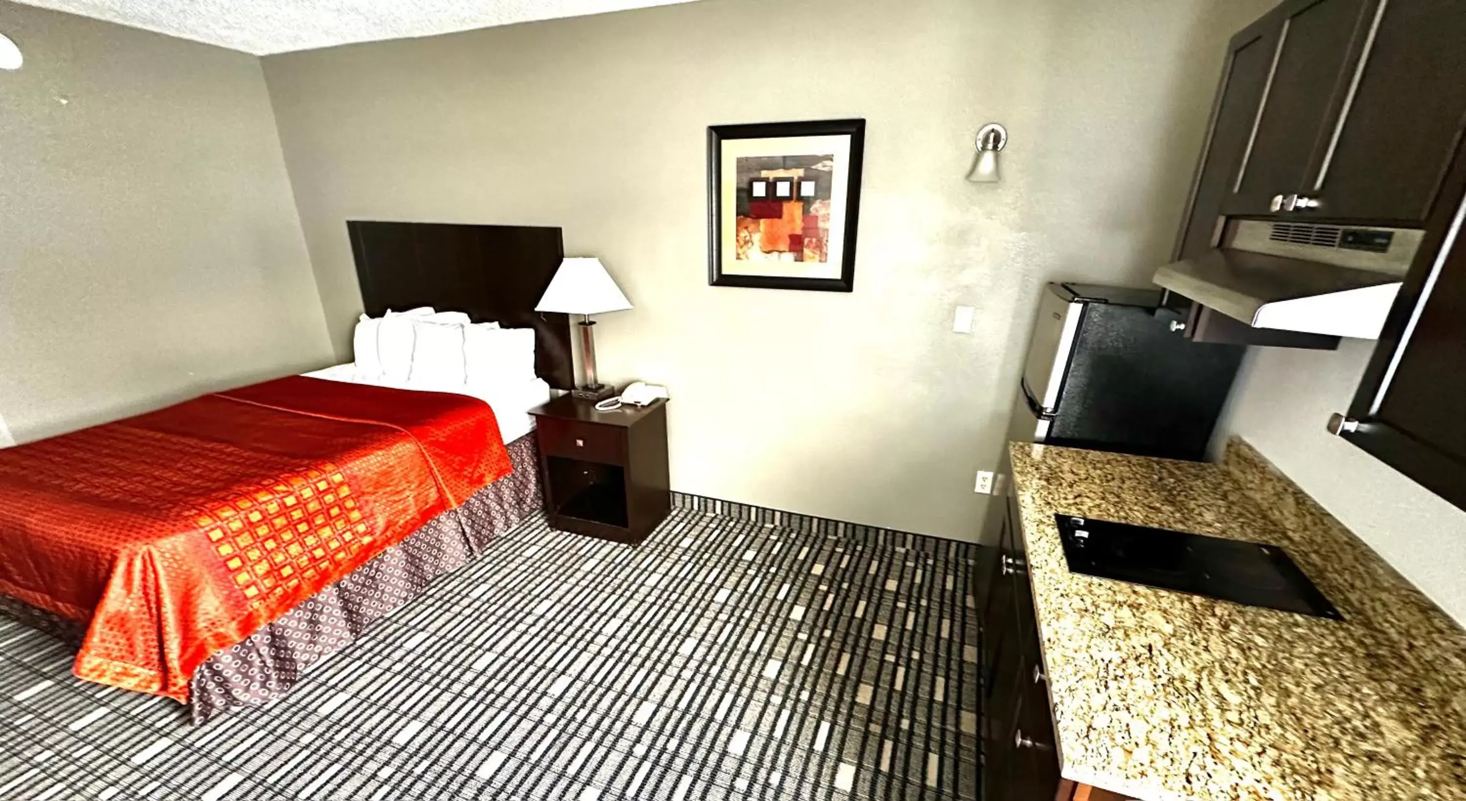 Guests, TV/Entertainment Center in SureStay Plus Hotel by Best Western Lubbock Medical Center