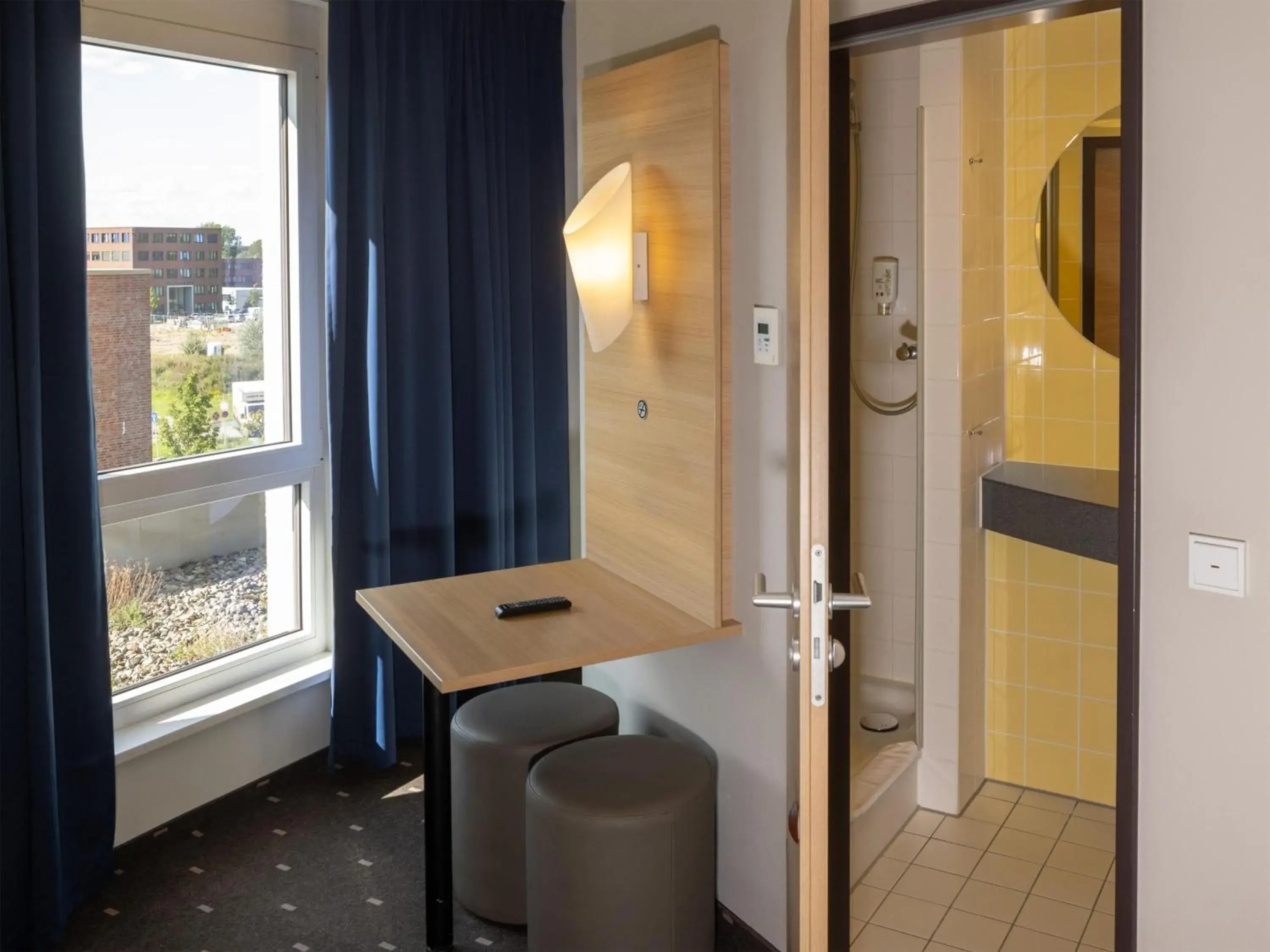 TV and multimedia, Bathroom in B&B Hotel Kiel-Wissenschaftspark