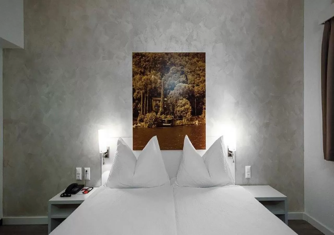Bed in Acquarello Swiss Quality Hotel
