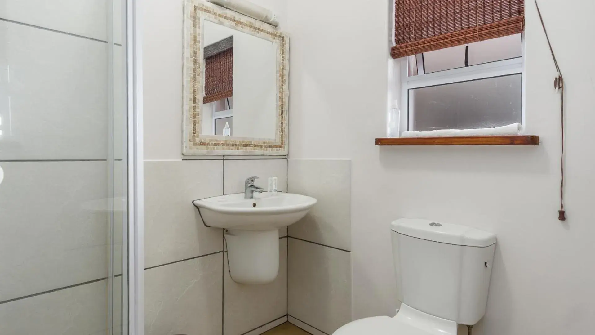 Toilet, Bathroom in Blue Bay Lodge