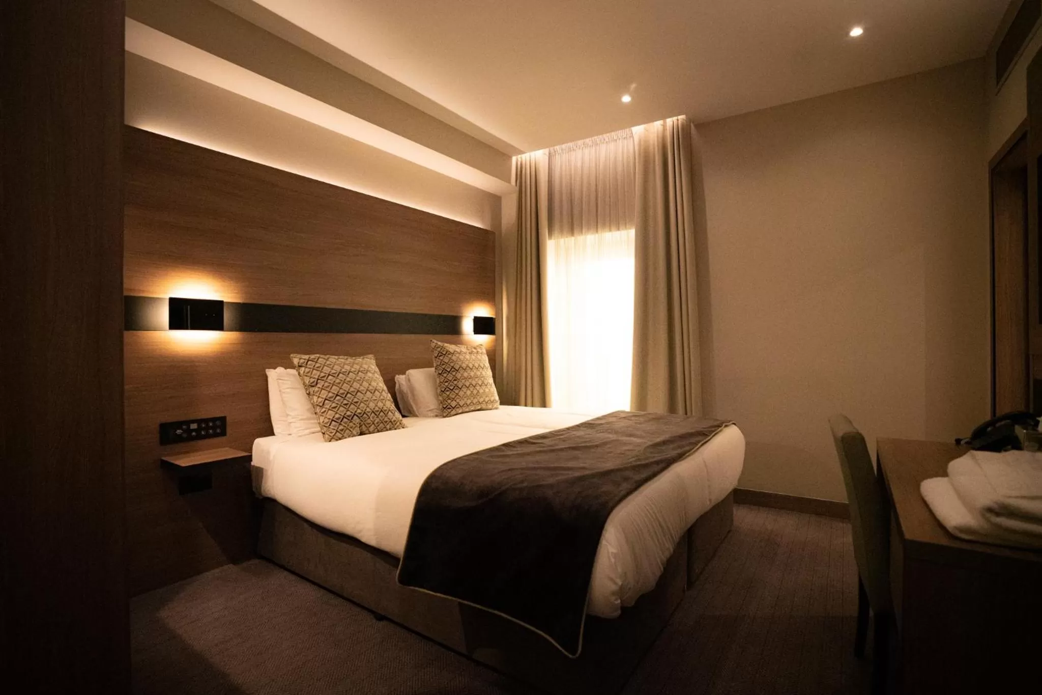 Bed in Merit Kensington Hotel