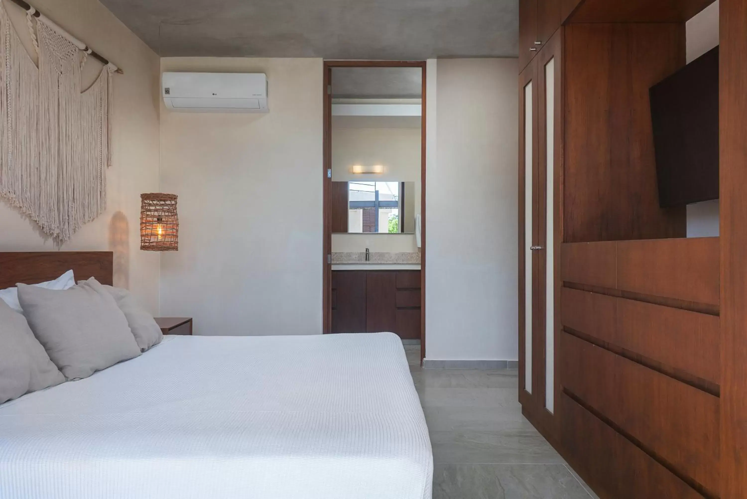 Bed in ARUNA TULUM-Luxury Studios & Apartments