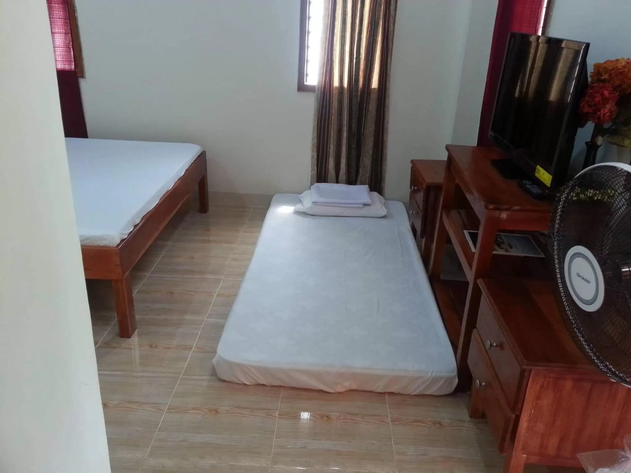 Bed in D's Oceanview Beach Resort