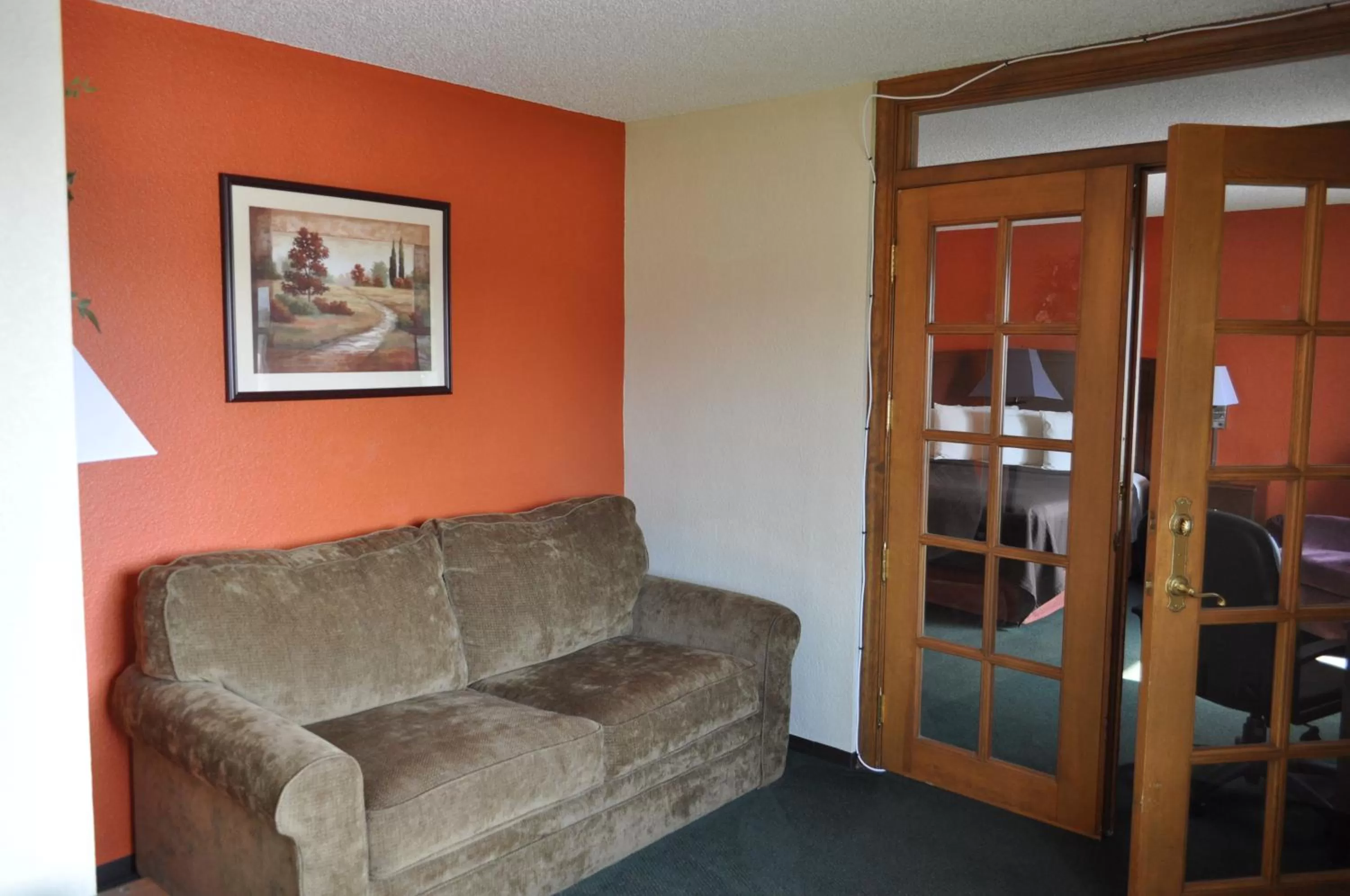 Living room in AmericInn by Wyndham Plymouth