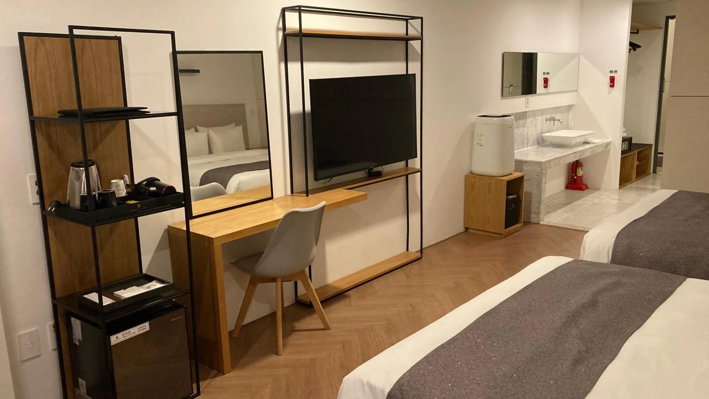 Bed in Hotel Noblestay