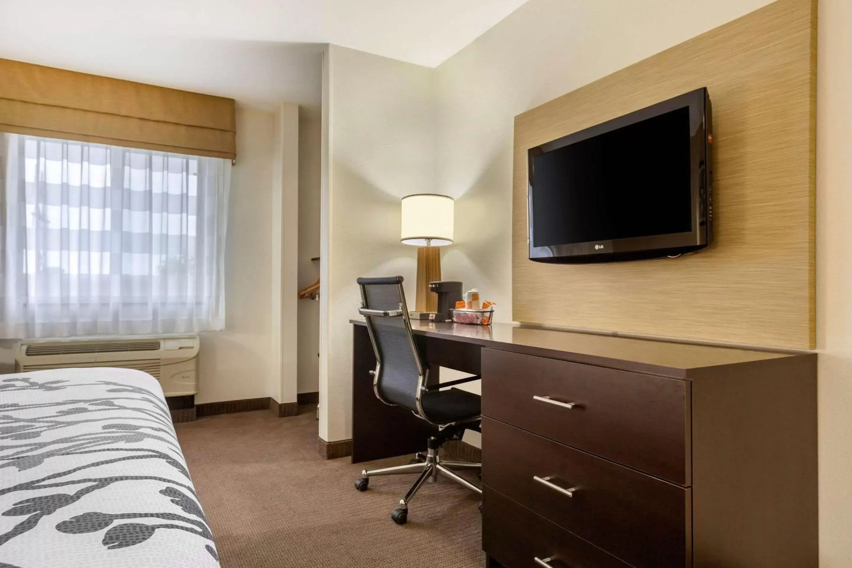 Photo of the whole room, TV/Entertainment Center in Sleep Inn & Suites Grand Forks Alerus Center