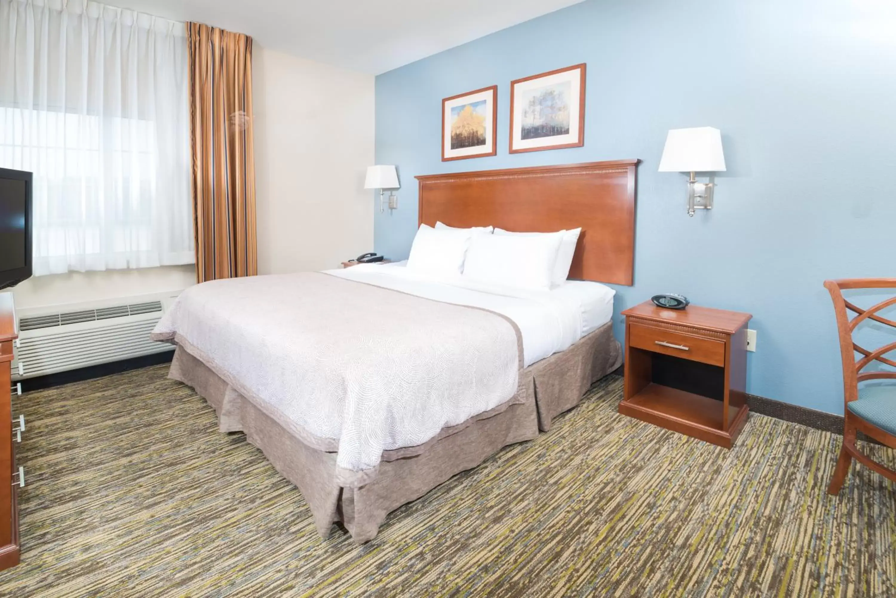 Photo of the whole room, Bed in Candlewood Suites Wake Forest-Raleigh Area, an IHG Hotel