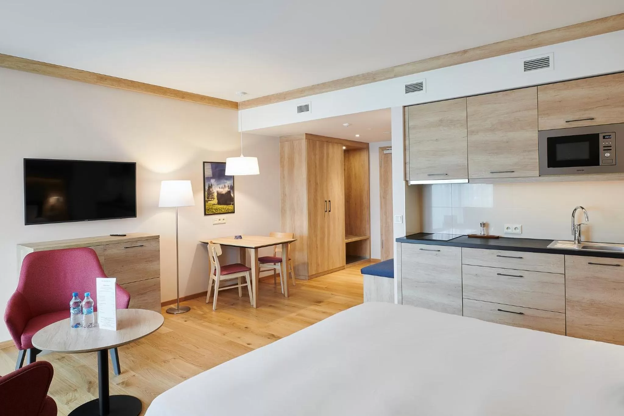 Kitchen or kitchenette, Bed in Radisson Blu Hotel & Residences