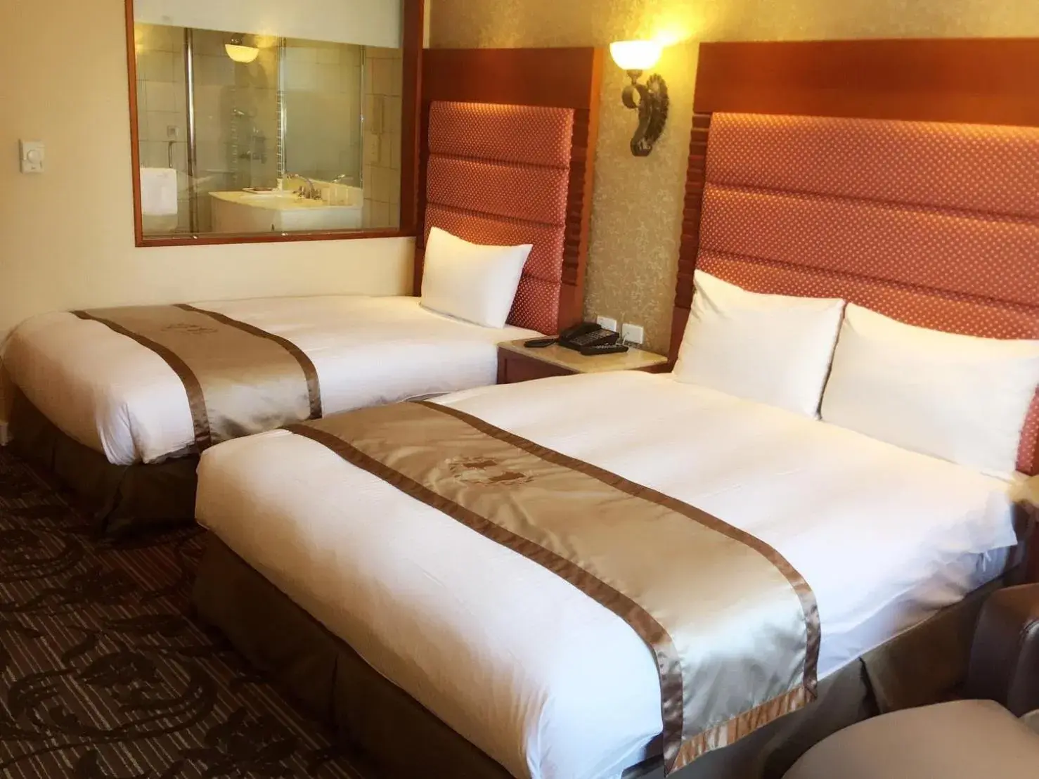 Bed in Charming City Hotel Hualien