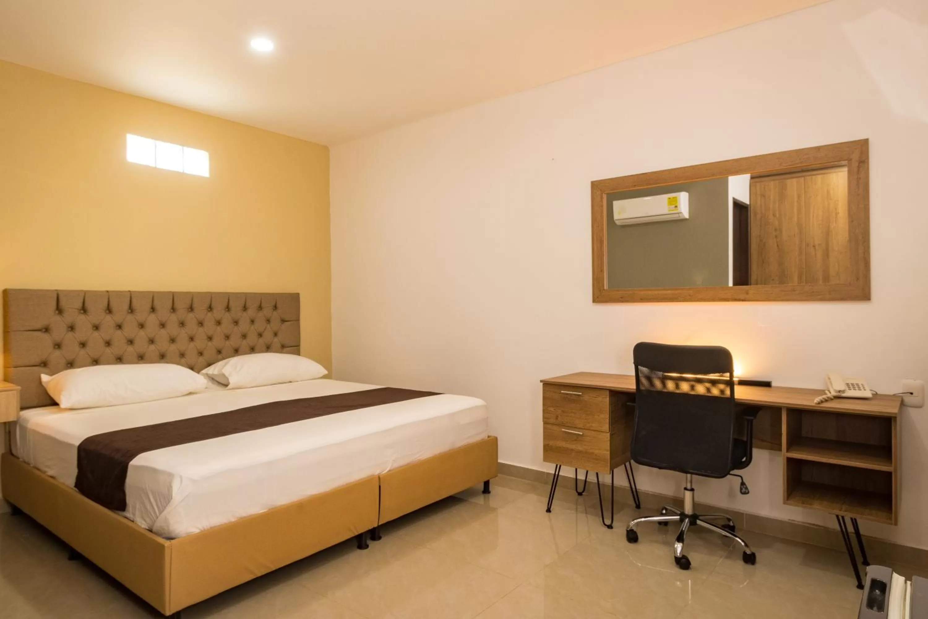 Bed in Genesis Hotel