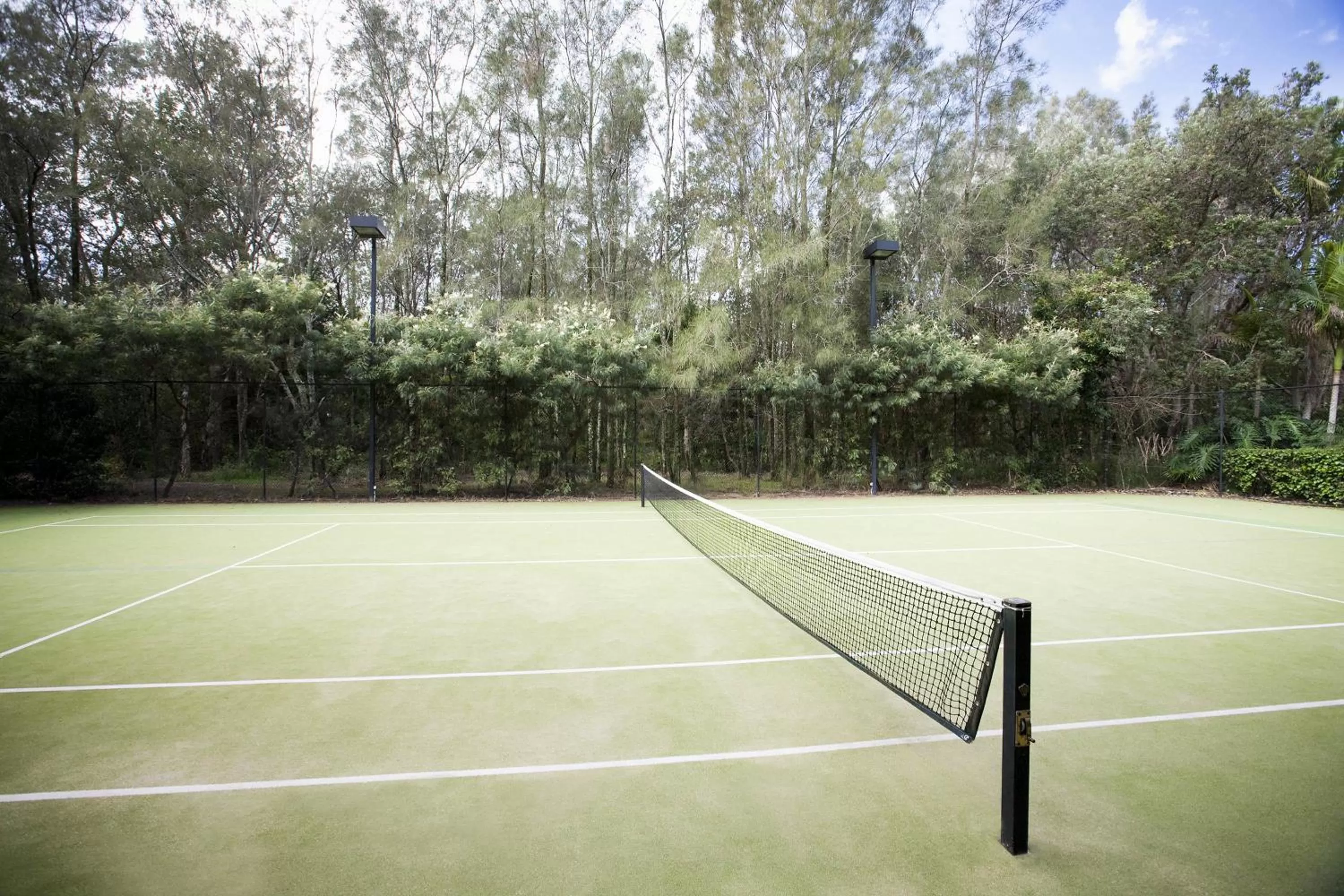 Tennis court in BreakFree Aanuka Beach Resort