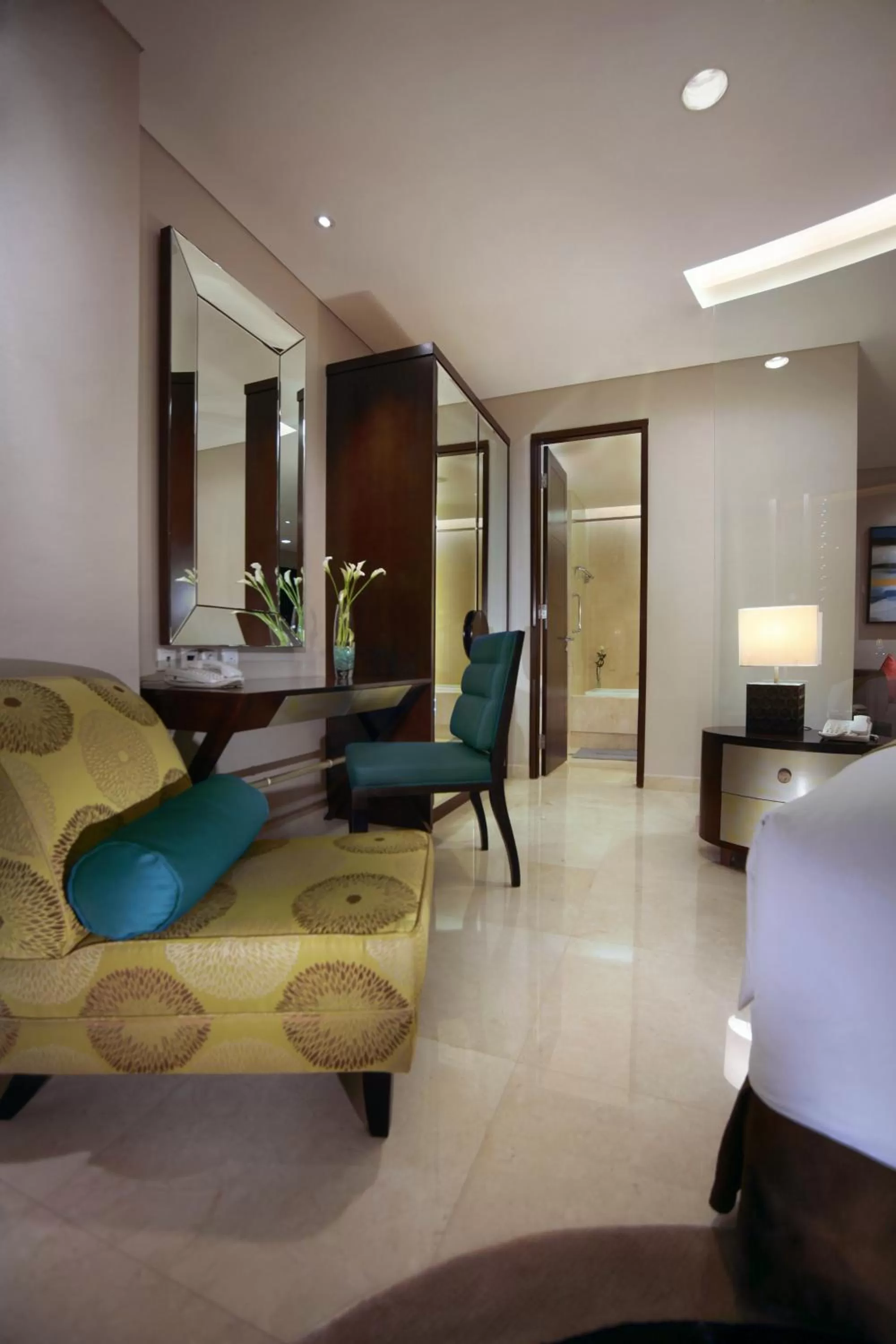 Seating area, Bed in The Grove Suites by Grand Aston