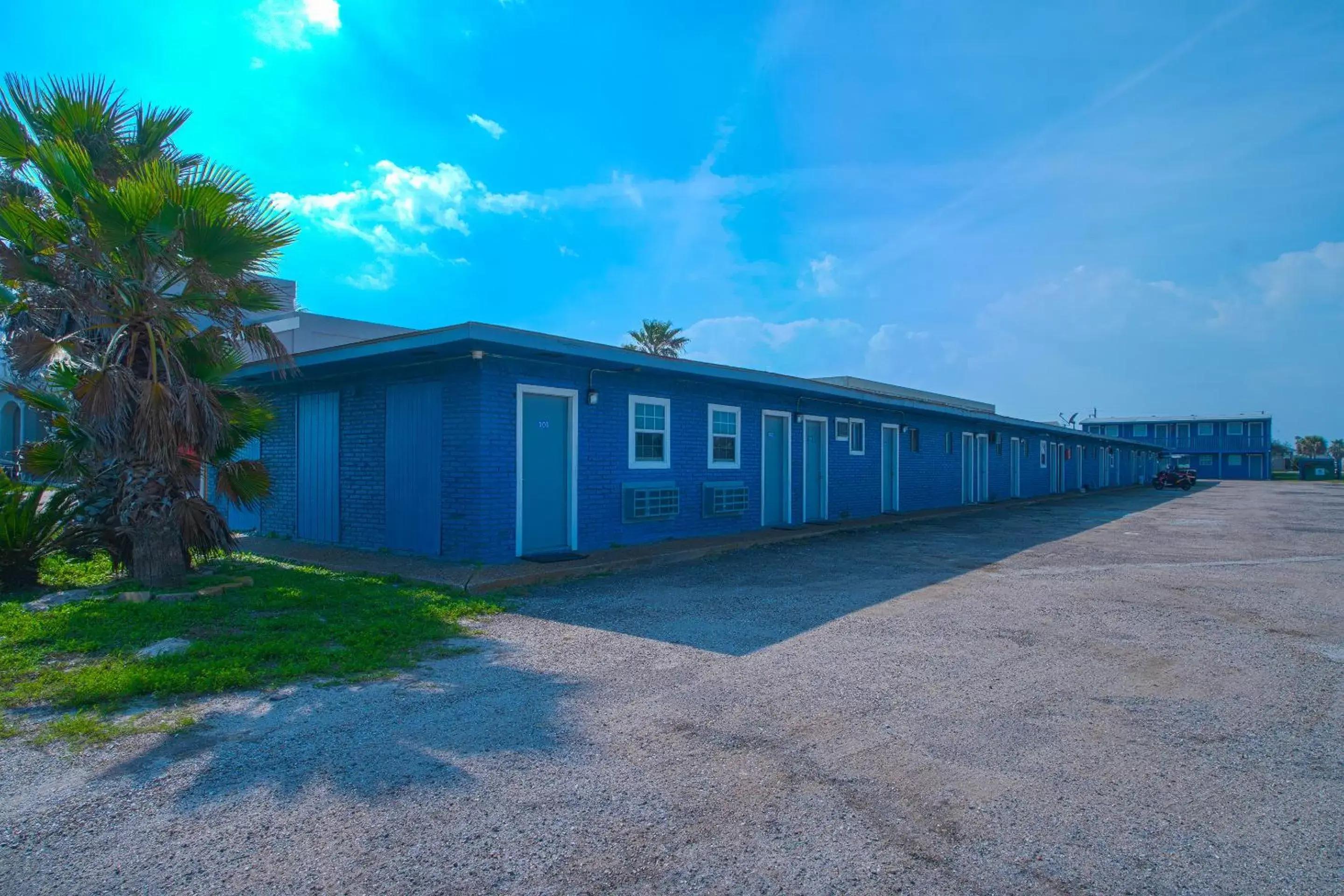 Parking, Property Building in Monterrey Motel Padre Island, Corpus Christi BY OYO