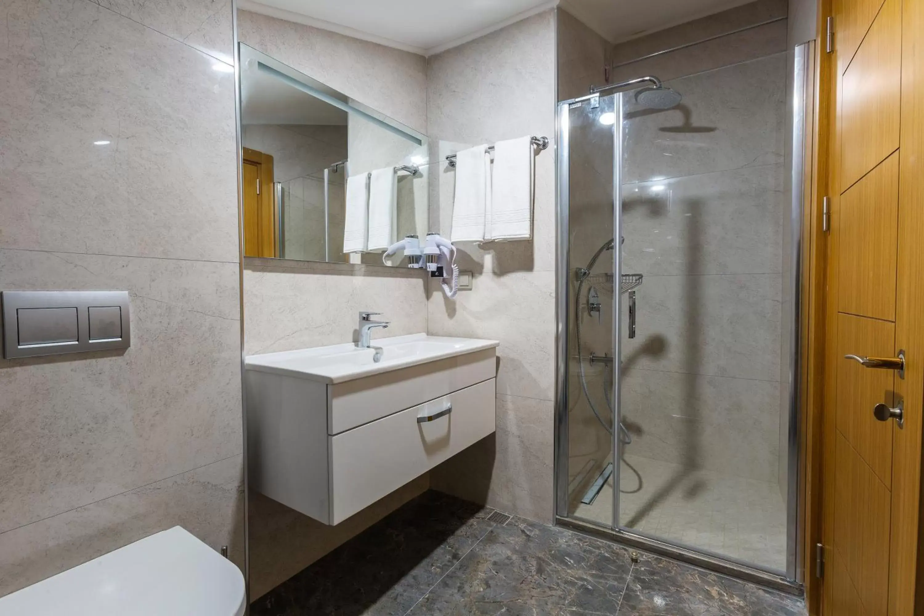 Bathroom in Obelisk Hotel & Suites