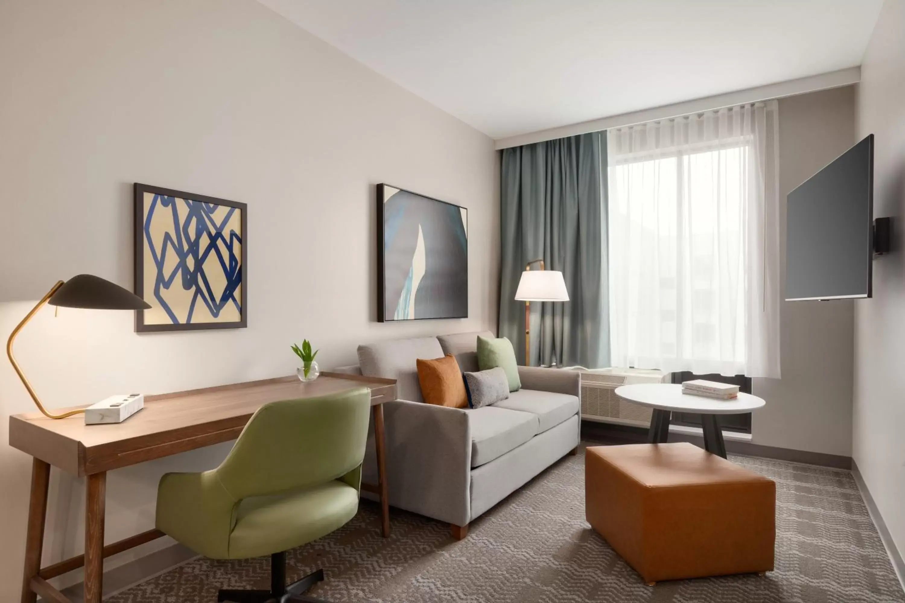 Bedroom, Seating Area in Staybridge Suites Rochester - Mayo Clinic Area, an IHG Hotel