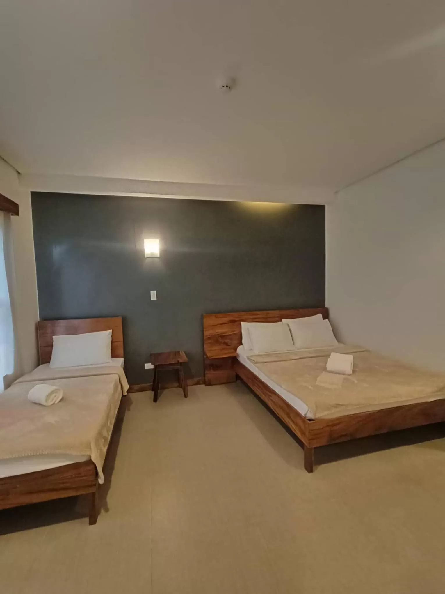 Bed in Acacia Garden Inn and Suites