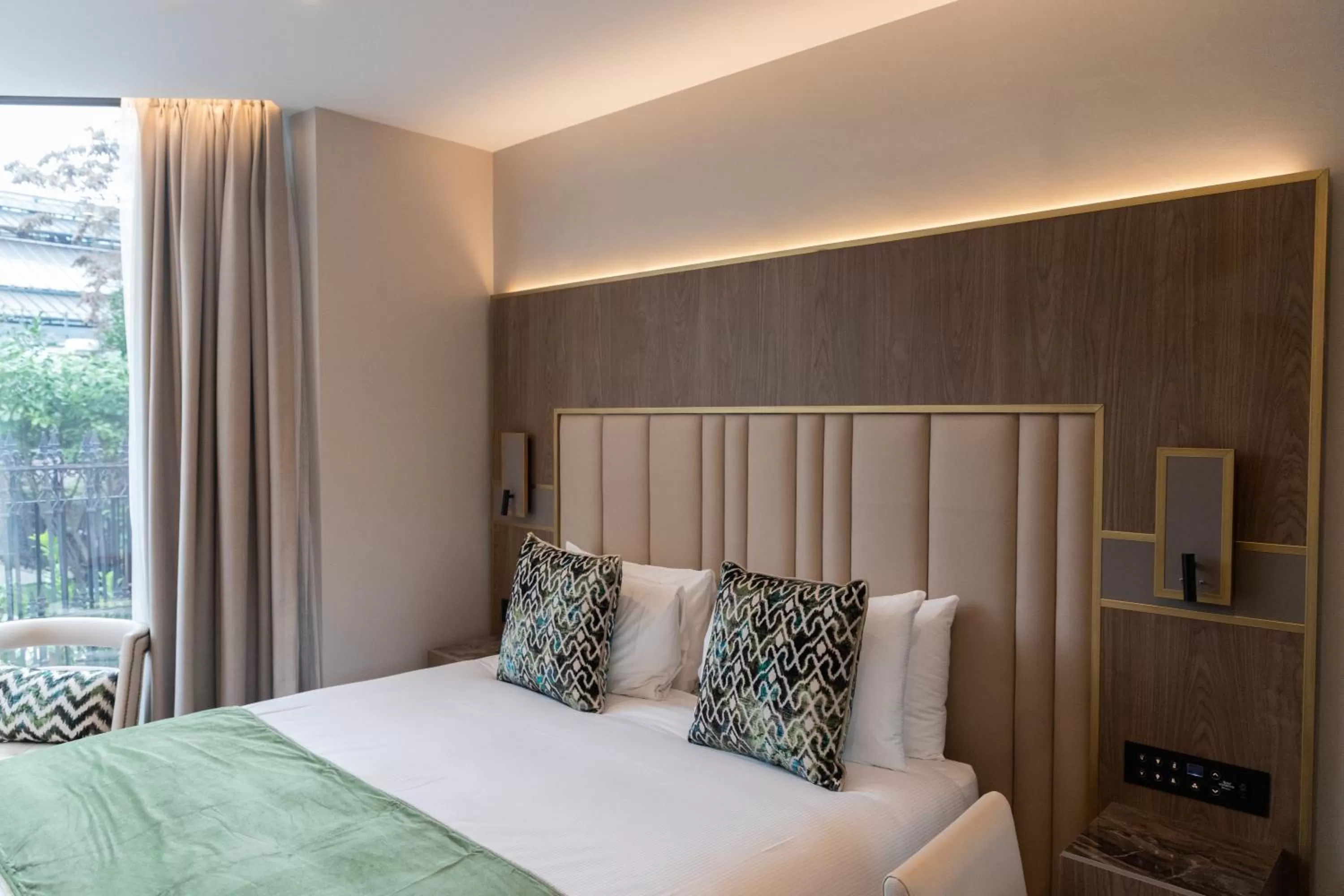 Bed in Merit Kensington Hotel