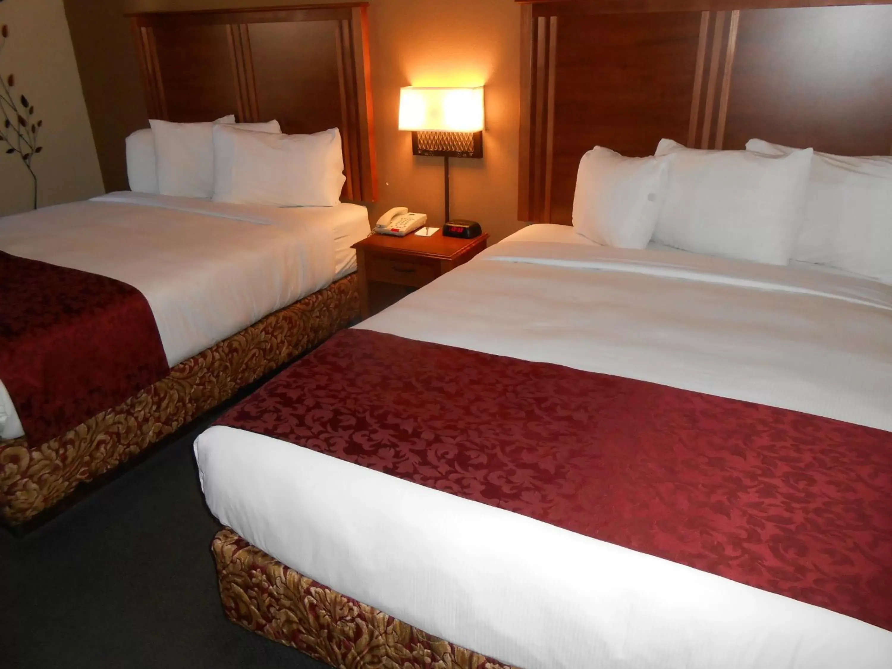 Bed in AmericInn by Wyndham McAlester