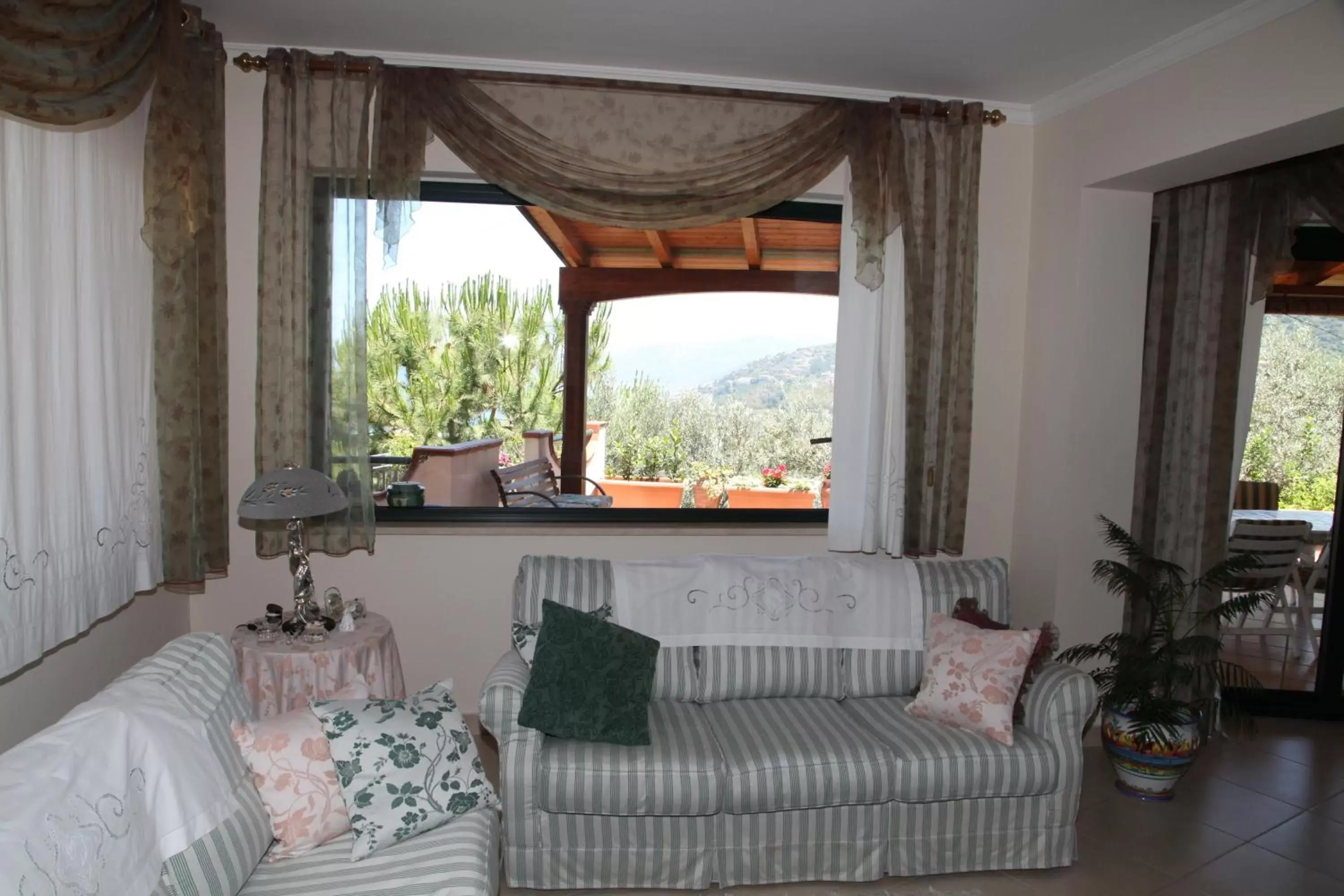 Communal lounge/ TV room, Seating Area in La Collina Capo d'Orlando