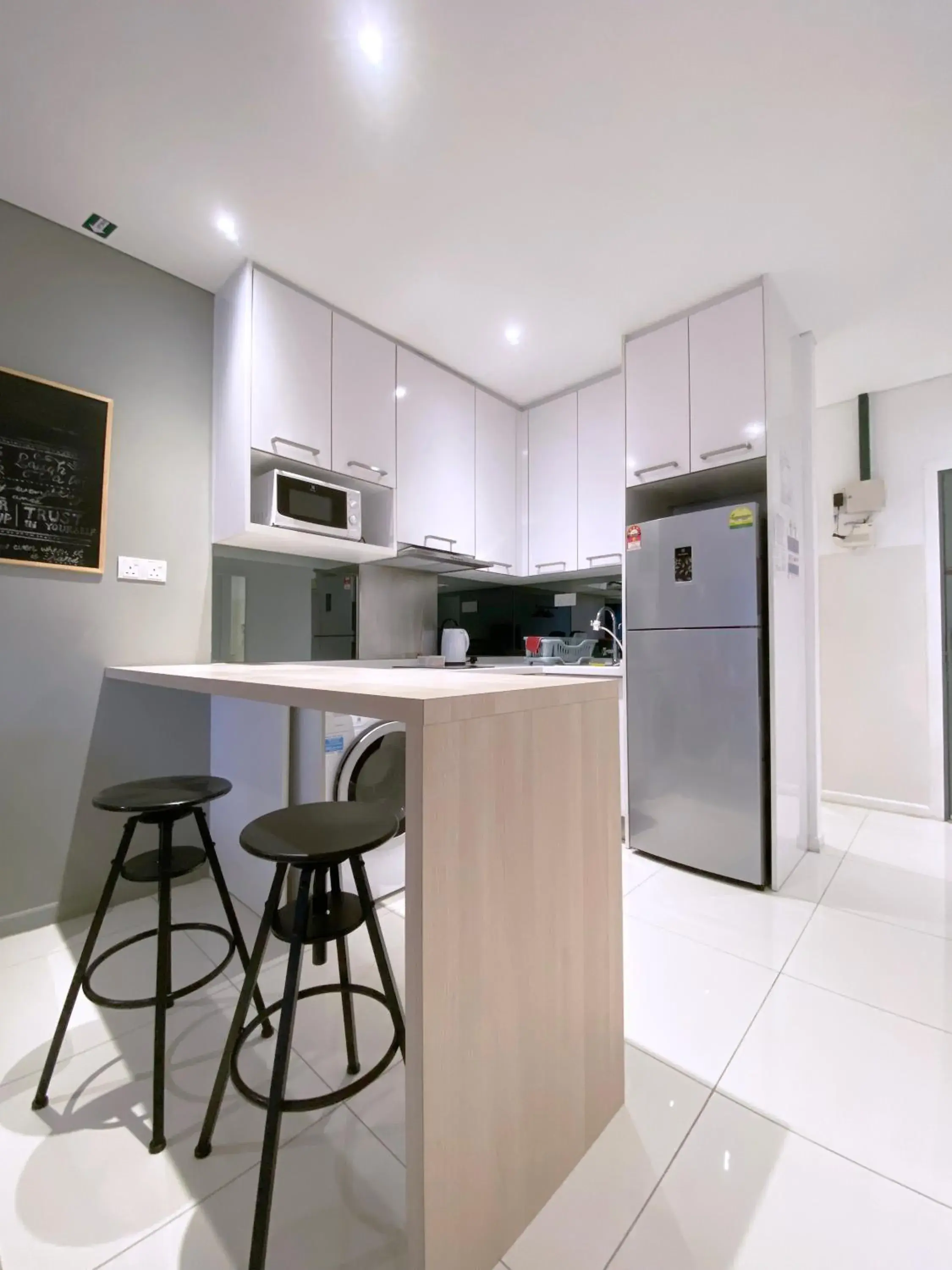 Kitchen/Kitchenette in Mercu Summer Suite KLCC @ Penguin Homes