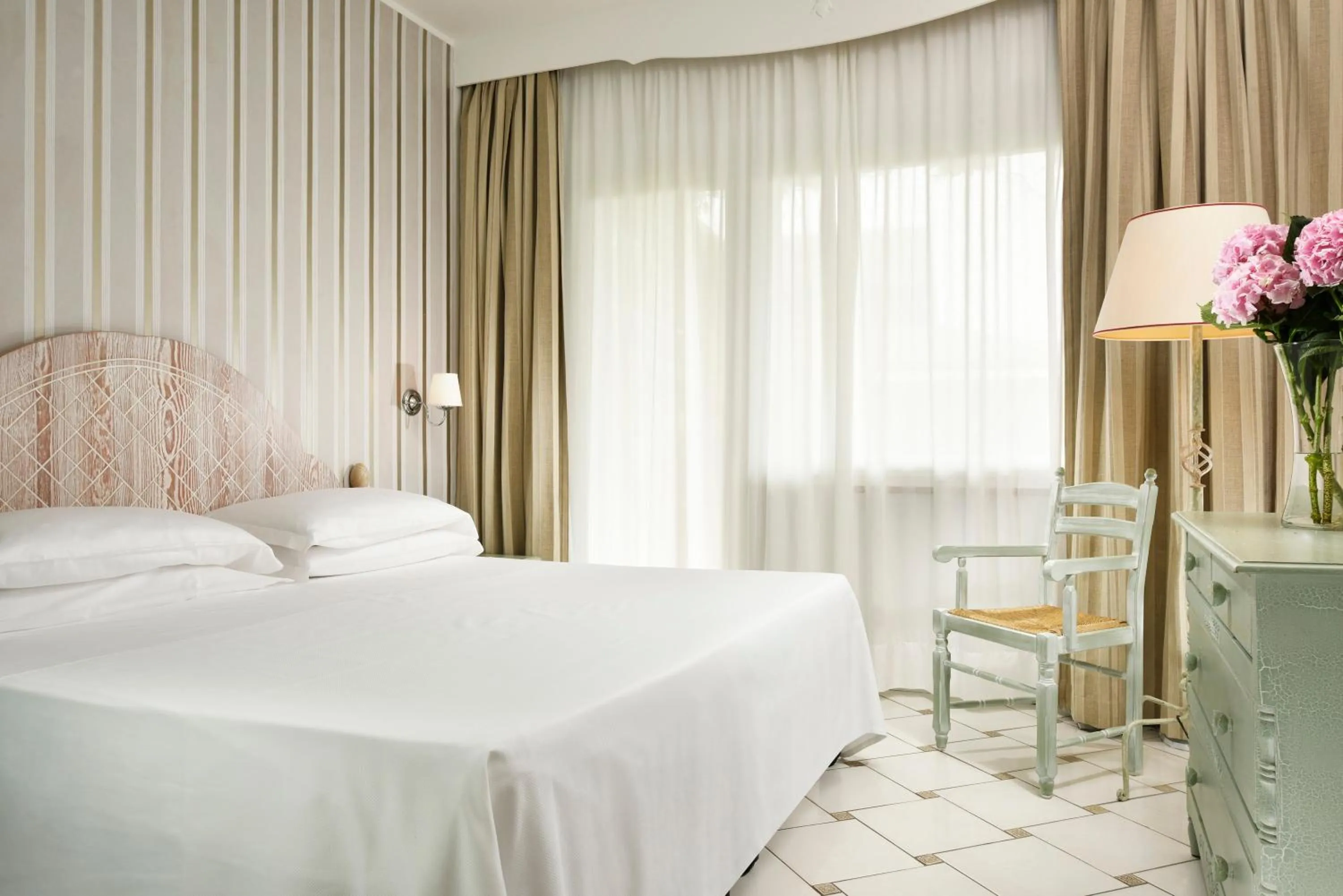 Bed in Golf Hotel Punta Ala