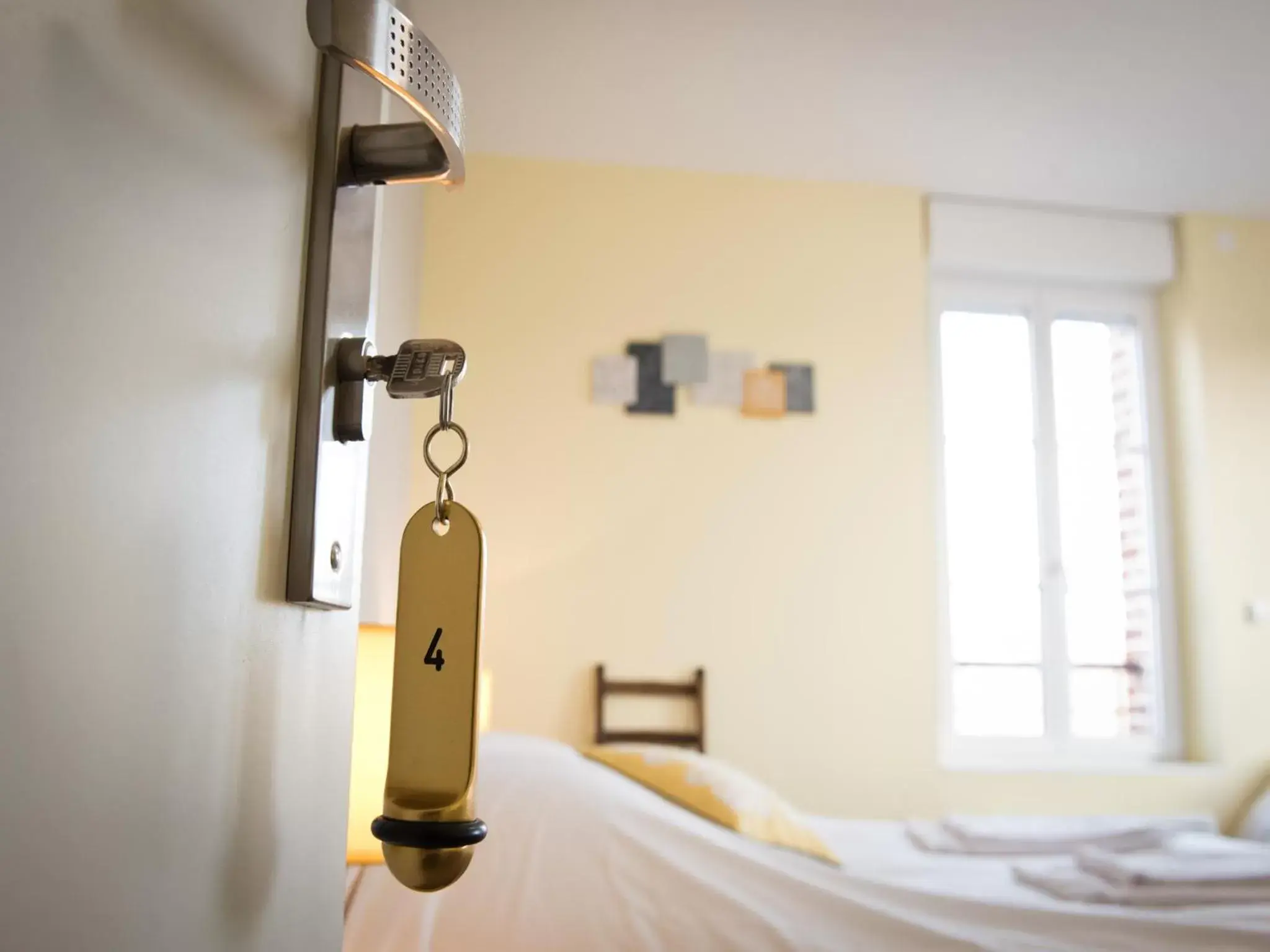 Decorative detail, Bed in Logis Hotel Restaurant Le Relais Fleuri Decorative detail, Bed in Logis Hotel Restaurant Le Relais Fleuri