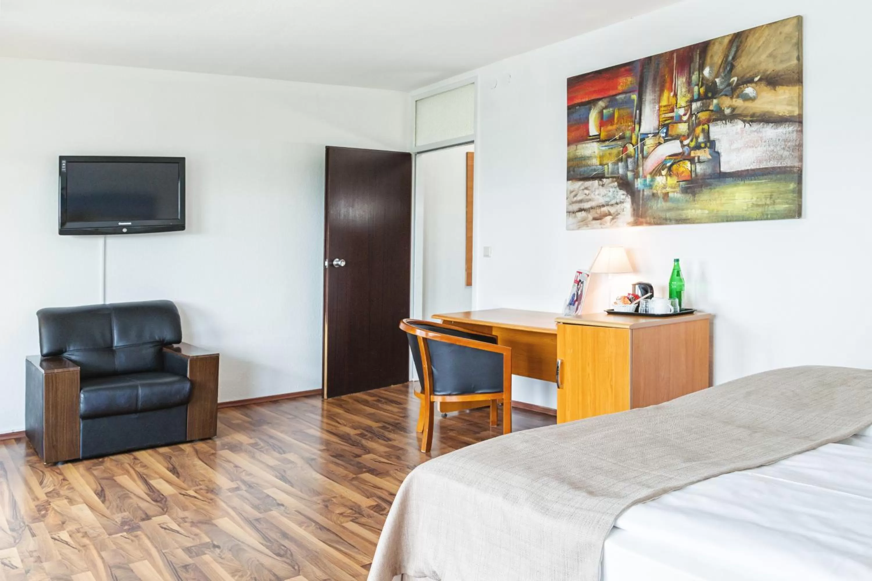 Photo of the whole room, Bed in Hotel Plöner See by Tulip Inn