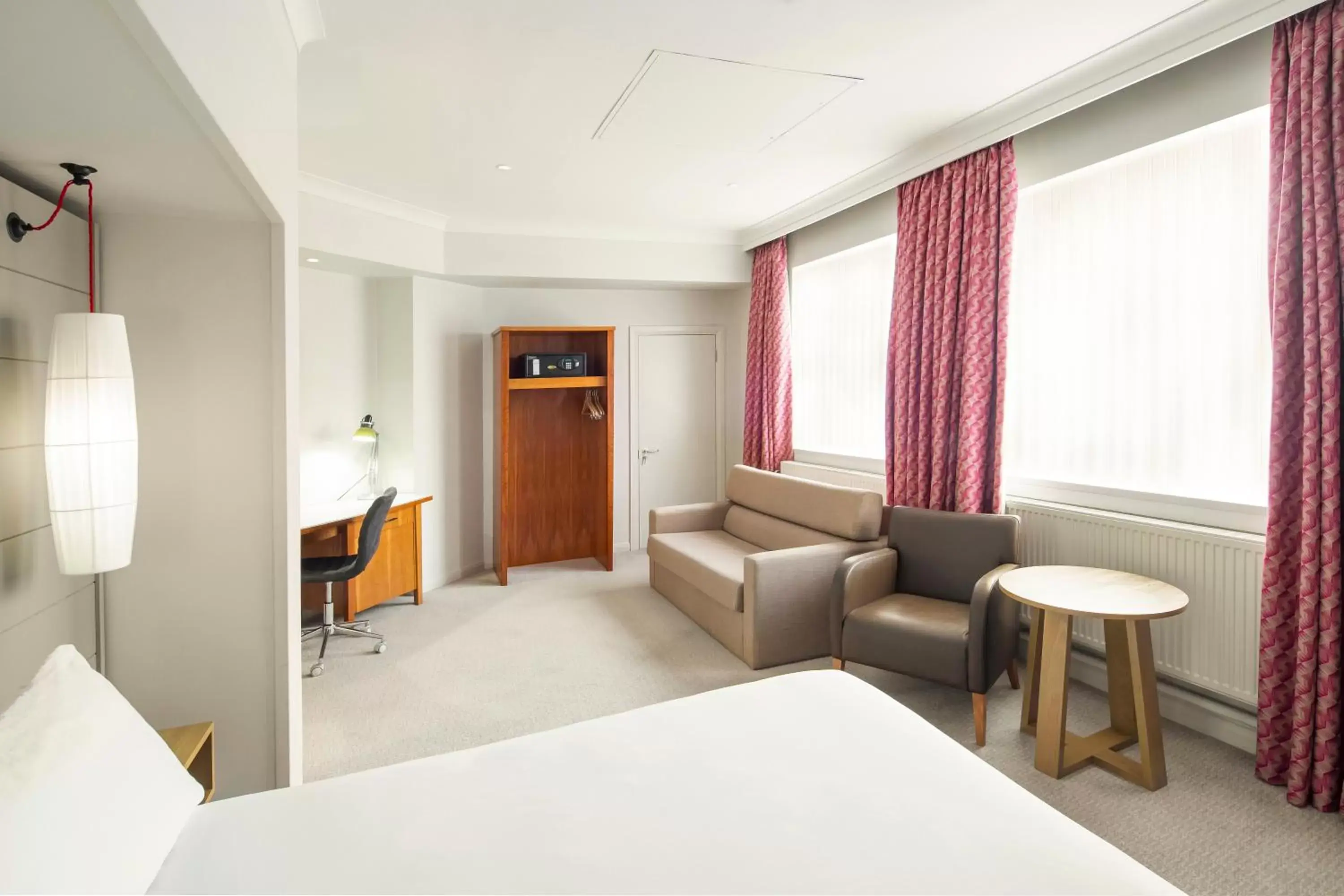 Bed, Seating Area in Holiday Inn Peterborough West, an IHG Hotel